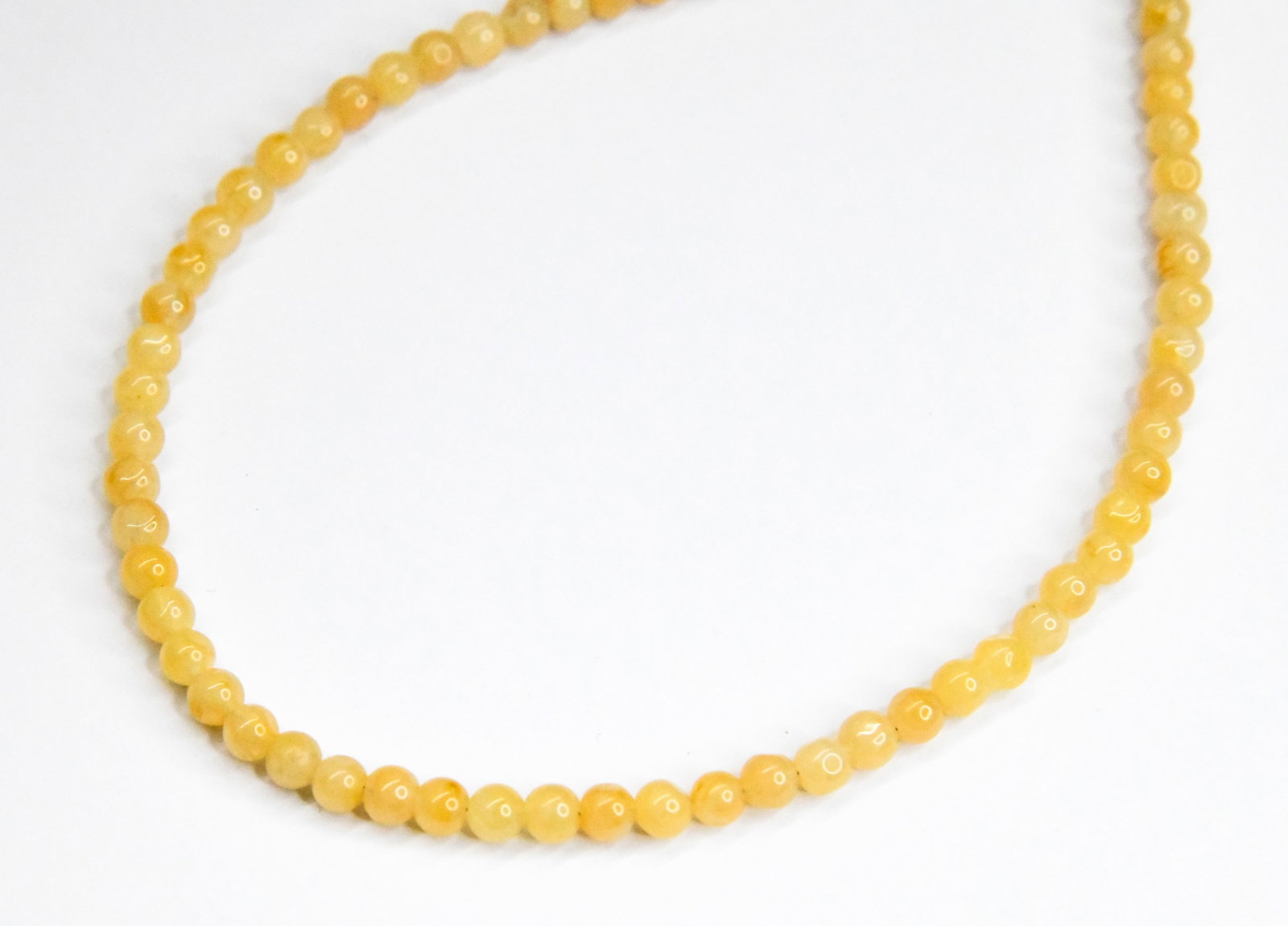 NATURAL YELLOW AVENTURINE BEADS ROUND 5 - 6 MM 17" STRAND: These are natural, earth mined and hand crafted with precision. Stone: Yellow Aventurine, Stone Shape: Round, Stone Size: 5 - 6 mm, Weight: approx. 113 carats. The photographs are generally enlarged t
