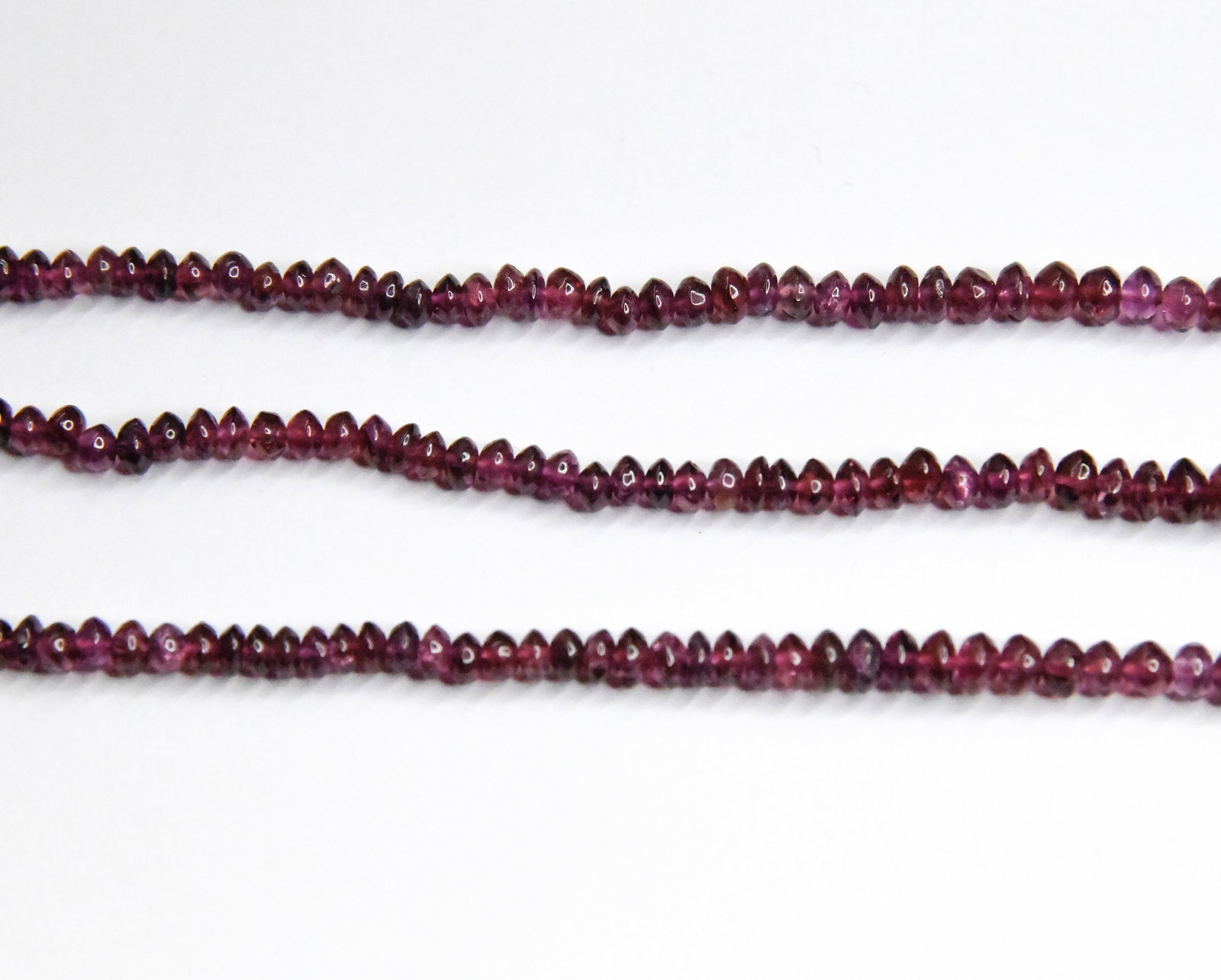 NATURAL GARNET BEADS RONDELLE 3 - 6 MM 17" STRAND: These are natural, earth mined and hand crafted with precision. Stone: Garnet, Stone Shape: Rondelle, Stone Size: 3 - 6 mm, Width: 1.5 - 3.5 mm, Weight: approx. 93 carats. The photographs are generall