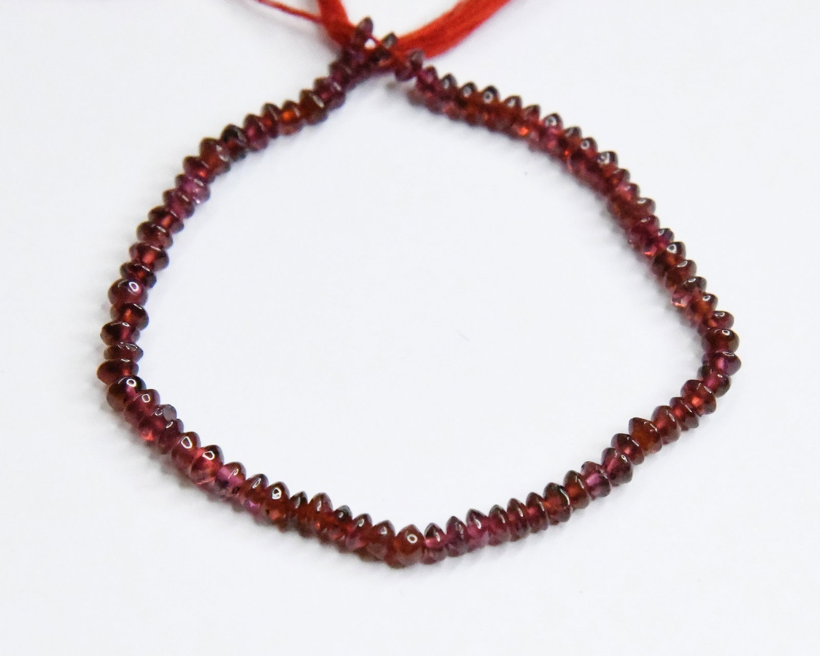 NATURAL GARNET BEADS RONDELLE 3.5 - 4 MM 6.5" STRAND: These are natural, earth mined and hand crafted with precision. Stone: Garnet, Stone Shape: Rondelle, Stone Size: 3.5 - 4 mm, Width: 1.5 - 2.5 mm, Weight: approx. 24 carats. The photographs are genera