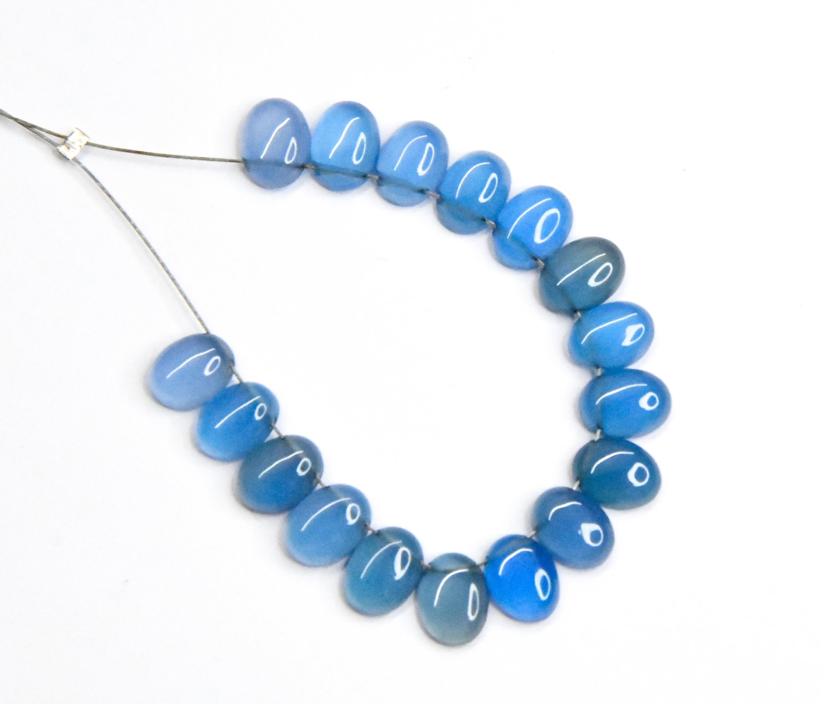 NATURAL CHALCEDONY BEADS FLATBACK OVAL 5X7 - 6X8 MM, 17 PCS: These are natural, earth mined and hand crafted with precision. Stone: Chalcedony, Stone Shape: Flatback Oval, Stone Size: 5.5x7.5 - 6x8 mm, Width: 2 - 3mm, Weight: approx. 18 carats. The photographs