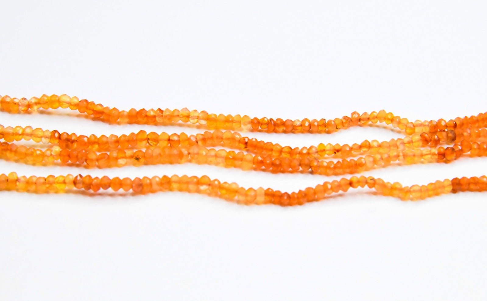 NATURAL CARNELIAN BEADS FACETED RONDELLE 2 - 3 MM, 16" STRAND (2 LINES): These are natural, earth mined and hand crafted with precision. Stone: Carnelian, Stone Shape: Faceted Rondelle, Stone Size: 2.5 - 3.5 mm, Width: 1 - 2.5 mm, Weight: approx. 29 carats. The photographs