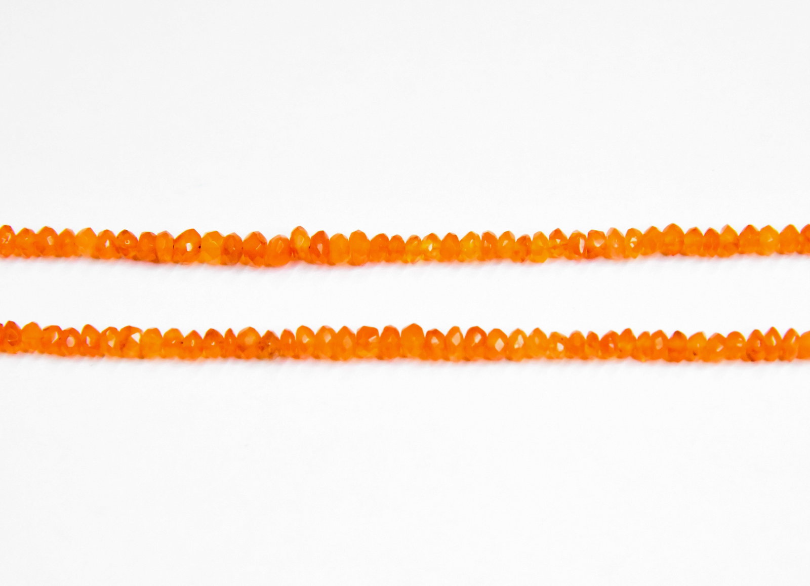 NATURAL CARNELIAN BEADS FACETED RONDELLE 3.5 - 4.5 MM, 5" STRAND (2 LINES): These are natural, earth mined and hand crafted with precision. Stone: Carnelian, Stone Shape: Faceted Rondelle, Stone Size: 3.5 - 4.5 mm, Width: 2 - 3 mm, Weight: approx. 18 carats. The photographs a