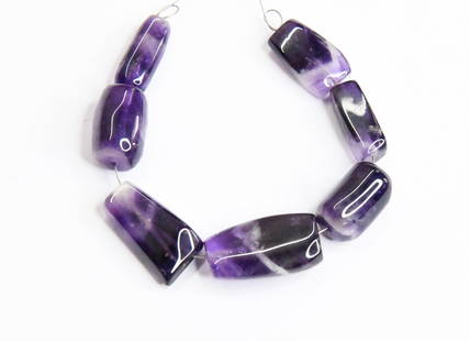 NATURAL BIO AMETHYST BEADS TUMBLE 7X17 - 7X22 MM, 7 PCS: These are natural, earth mined and hand crafted with precision. Stone: Amethyst, Stone Shape: Tumble, Stone Size: 7x17 - 7x22 mm, Width: 5.5 - 10 mm, Weight: approx. 82 carats. The photographs are gen
