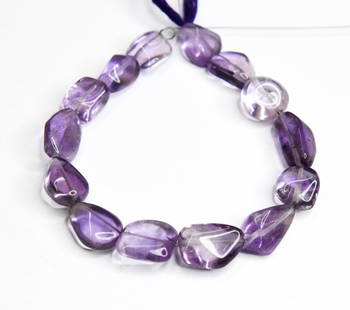 NATURAL AMETHYST BEADS TUMBLE 9X10 - 11X15 MM, 7" STRAND: These are natural, earth mined and hand crafted with precision. Stone: Amethyst, Stone Shape: Tumble, Stone Size: 9x10 - 11x15 mm, Width: 3.5 - 7 mm, Weight: approx. 94 carats. The photographs are gen