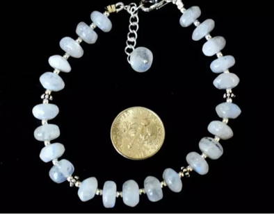 7 - 8" SOLID 925 SILVER BRACELET NATURAL RAINBOW MOONSTONE BEADS: These are natural, earth mined and hand crafted with precision. Stone: Rainbow Moonstone, Stone Shape: Rondelle, Stone Size: 8 mm, Width - 4 - 5 mm, Length: 7 - 8", Weight: approx. 72 carats. The phot