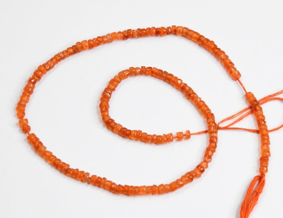 NATURAL CARNELIAN BEADS TYRE 3 - 3.5 MM, 13.5" STRAND: These are natural, earth mined and hand crafted with precision. Stone: Carnelian, Stone Shape: Tyre, Stone Size: 3 - 3.5 mm, Width: 1.5 - 2.5 mm, Weight: 40 carats. The photographs are generally enlar