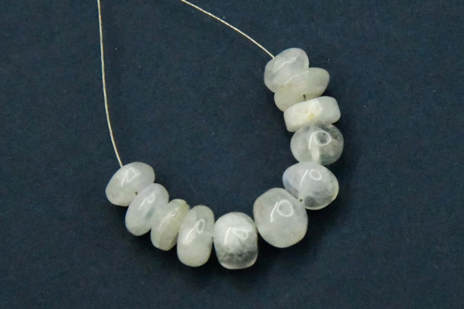 NATURAL RAINBOW MOONSTONE BEADS RONDELLE 6.5 - 8 MM 11 PCS: These are natural, earth mined and hand crafted with precision. Stone: Rainbow Moonstone, Stone Shape: Rondelle, Stone Size: 6.5 - 8 mm, Width: 4 - 6.5 mm, Weight: approx. 20 carats. The photographs a