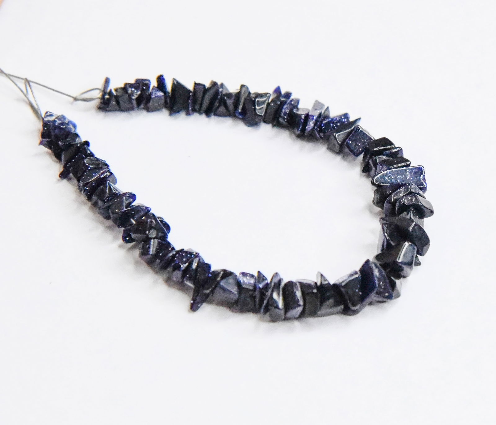 NATURAL BLUE GOLDSTONE BEADS CHIPS 2X2.5 - 4X6 MM, 4" LINE: These are natural, earth mined and hand crafted with precision. Stone: Blue Gold Stone, Stone Shape: Chips, Stone Size: 2x2.5 - 4x6 mm, Width: 1 - 2 mm, Weight: approx. 16 carats. The photographs are