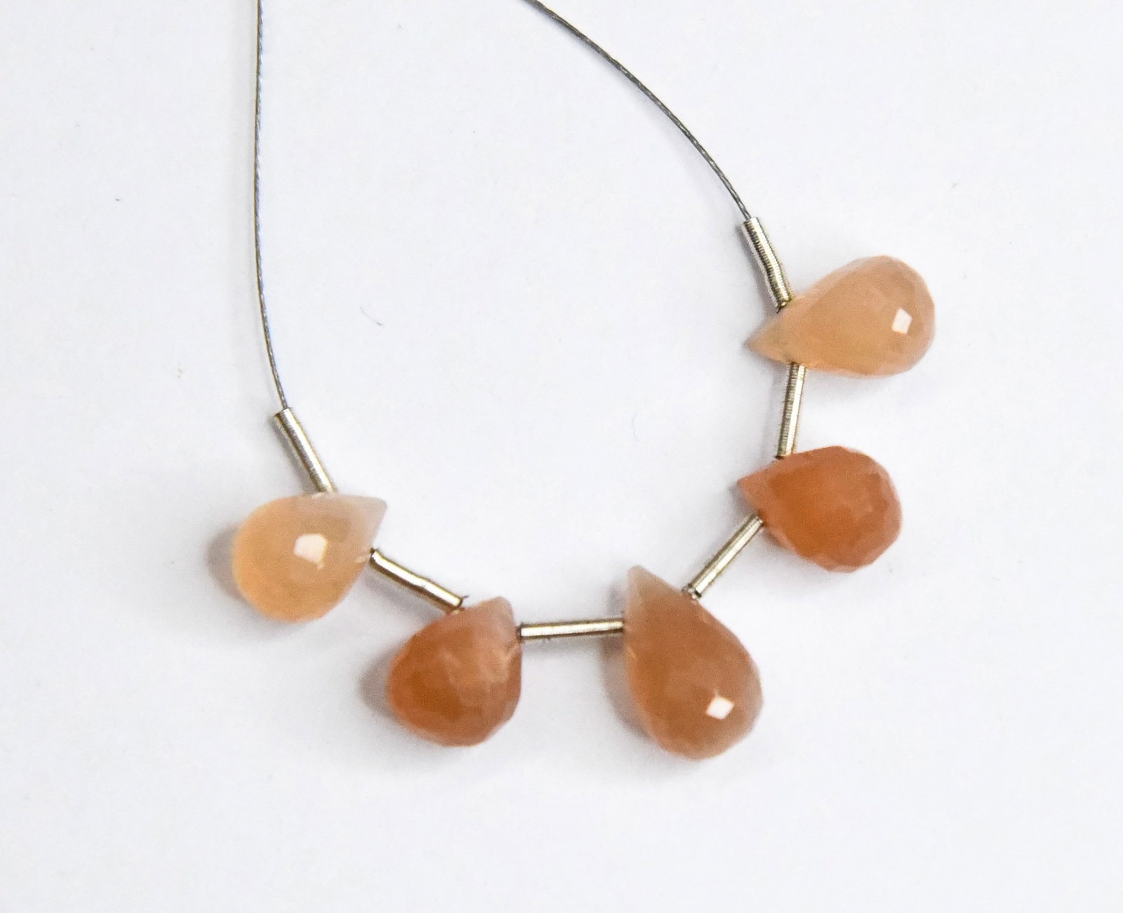NATURAL PEACH MOONSTONE BEADS FACETED BRIOLETTE 6X8 - 6X10 MM, 5 PCS: These are natural, earth mined and hand crafted with precision. Stone: Peach Moonstone, Stone Shape: Faceted Briolette, Stone Size: 6x8 - 6x10 mm, Weight: approx. 8.5 carats. The photographs are gener