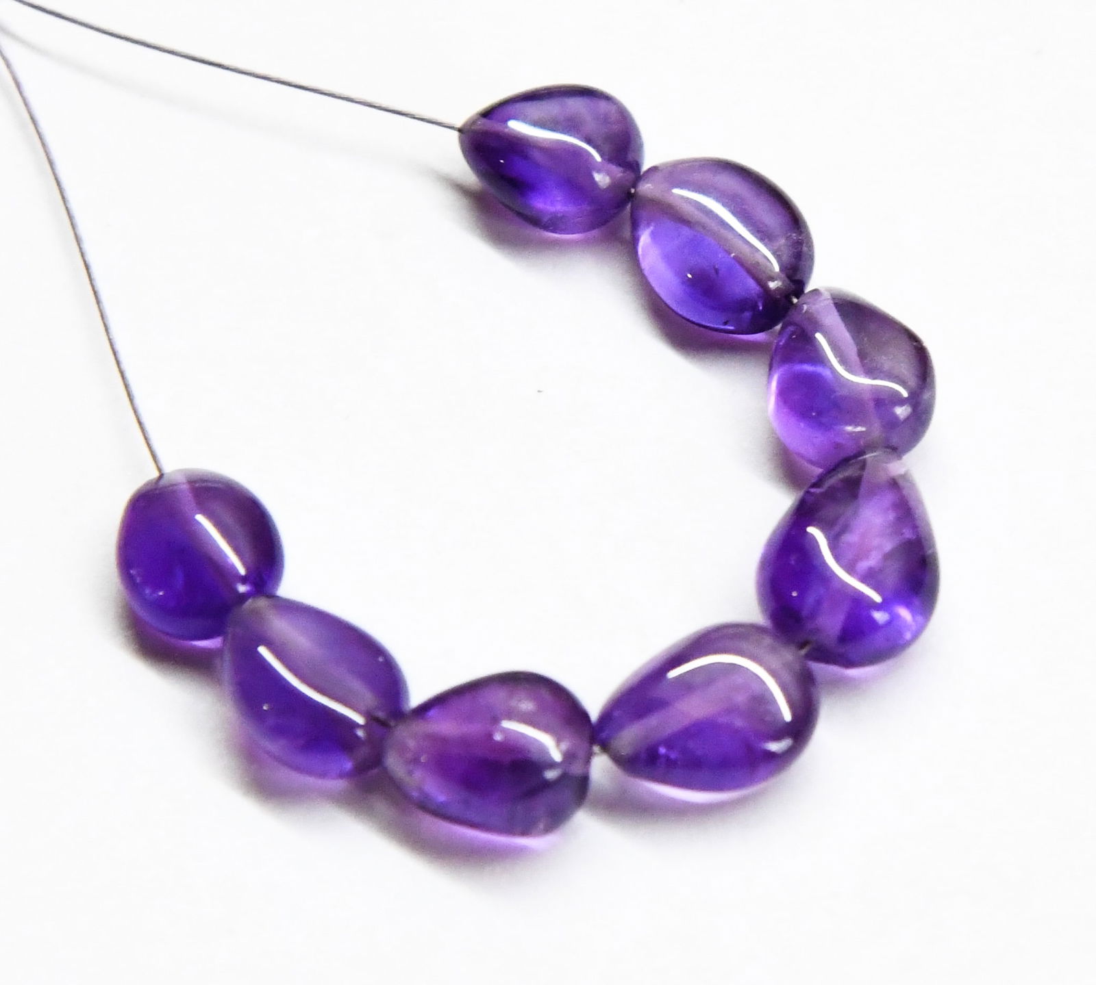 NATURAL AMETHYST BEADS TOPDRILL PEAR 6X7 - 7X9 MM, 8 PCS: These are natural, earth mined and hand crafted with precision. Stone: Amethyst, Stone Shape: Topdrill Pear, Stone Size: 6x7 - 7x9 mm, Width: 4 - 5 mm, Weight: approx. 14 carats. The photographs are g