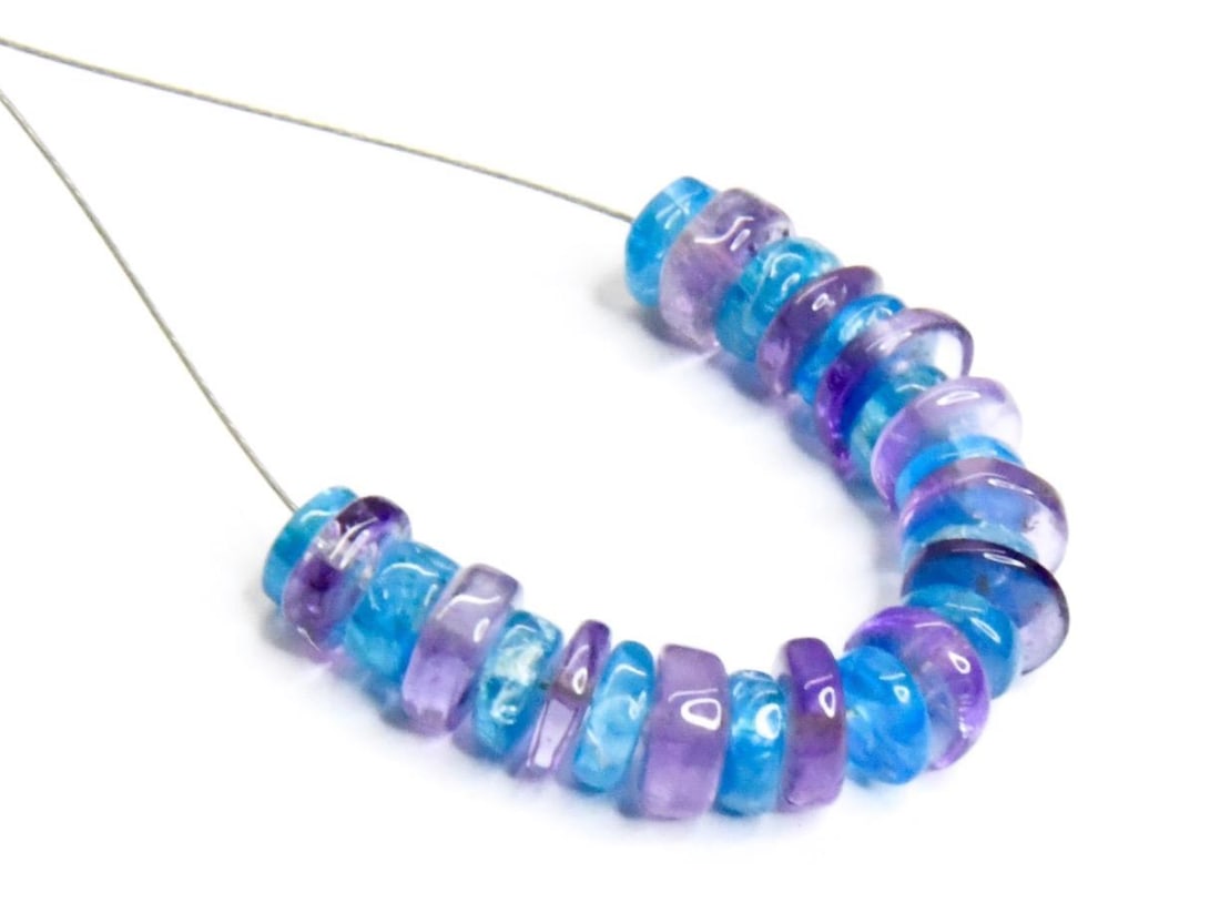 NATURAL APATITE AND AMETHYST BEADS TYRE 25 PCS, 4 - 5 MM (2 TASSELS): These are natural, earth mined and hand crafted with precision. Stone: Apatite/Amethyst, Stone Shape: Tyre, Stone Size: 4 - 5 mm, Width: 1.5 - 2 mm, Weight: approx. 10 carats. The photographs are gene