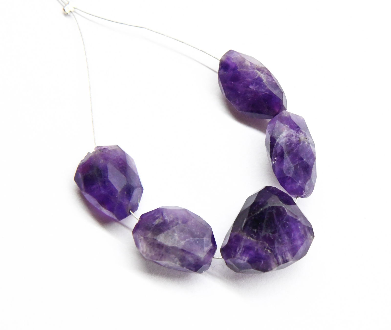NATURAL AMETHYST BEADS FACETED TUMBLE 9X15 - 14X17 MM, 5 PCS: These are natural, earth mined and hand crafted with precision. Stone: Amethyst, Stone Shape: Faceted Tumble, Stone Size: 9x15 - 14x17 mm, Width: 8 - 11 mm, Weight: approx. 55 carats. The photographs