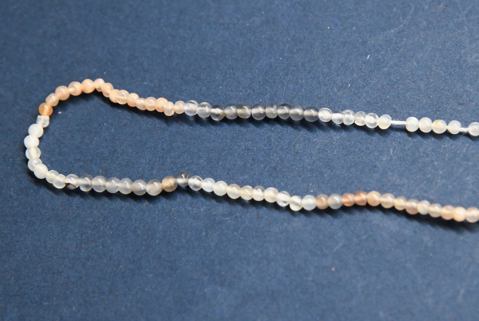 NATURAL MULTI MOONSTONE BEADS ROUND 2.5 MM, 6.5" STRAND: These are natural, earth mined and hand crafted with precision. Stone: Multi Moonstone, Stone Shape: Round, Stone Size: 2.5 mm, Weight: approx. 6.5 carats. The photographs are generally enlarged to sh