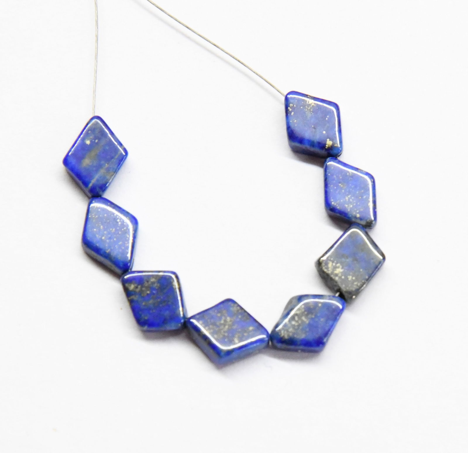 NATURAL LAPIS LAZULI BEADS DIAMOND 7X10 - 8X10 MM, 8 PCS: These are natural, earth mined and hand crafted with precision. Stone: Lapis Lazuli, Stone Shape: Diamond, Stone Size: 7x10 - 8x10 mm, Width: 2.5 - 3 mm, Weight: approx. 16 carats. The photographs are