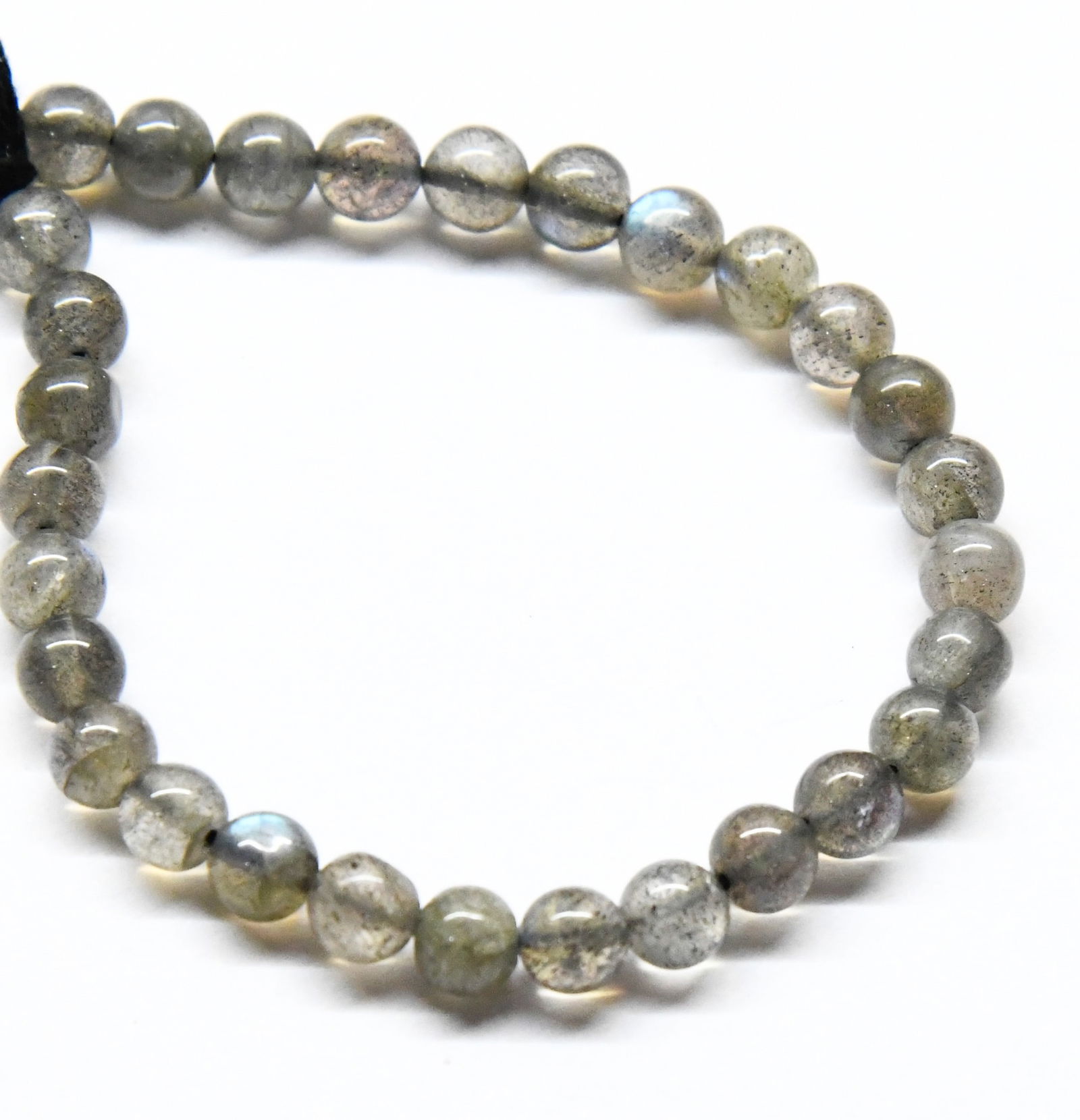 NATURAL LABRADORITE BEADS ROUND 5 - 5.5 MM, 6" STRAND: These are natural, earth mined and hand crafted with precision. Stone: Labradorite, Stone Shape: Round, Stone Size: 5 - 5.5 mm, Weight: approx. 32 carats. The photographs are generally enlarged to sho