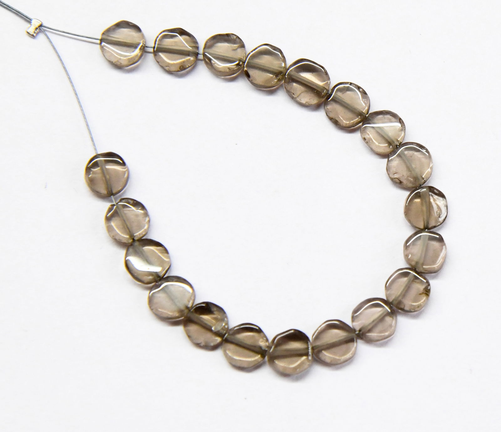 NATURAL SMOKY QUARTZ BEADS COIN 6.5 MM, 20 PCS: These are natural, earth mined and hand crafted with precision. Stone: Smoky Quartz, Stone Shape: Coin, Stone Size: 6.5 mm, Width: 2 - 3 mm, Weight: approx. 21 carats. The photographs are generally en