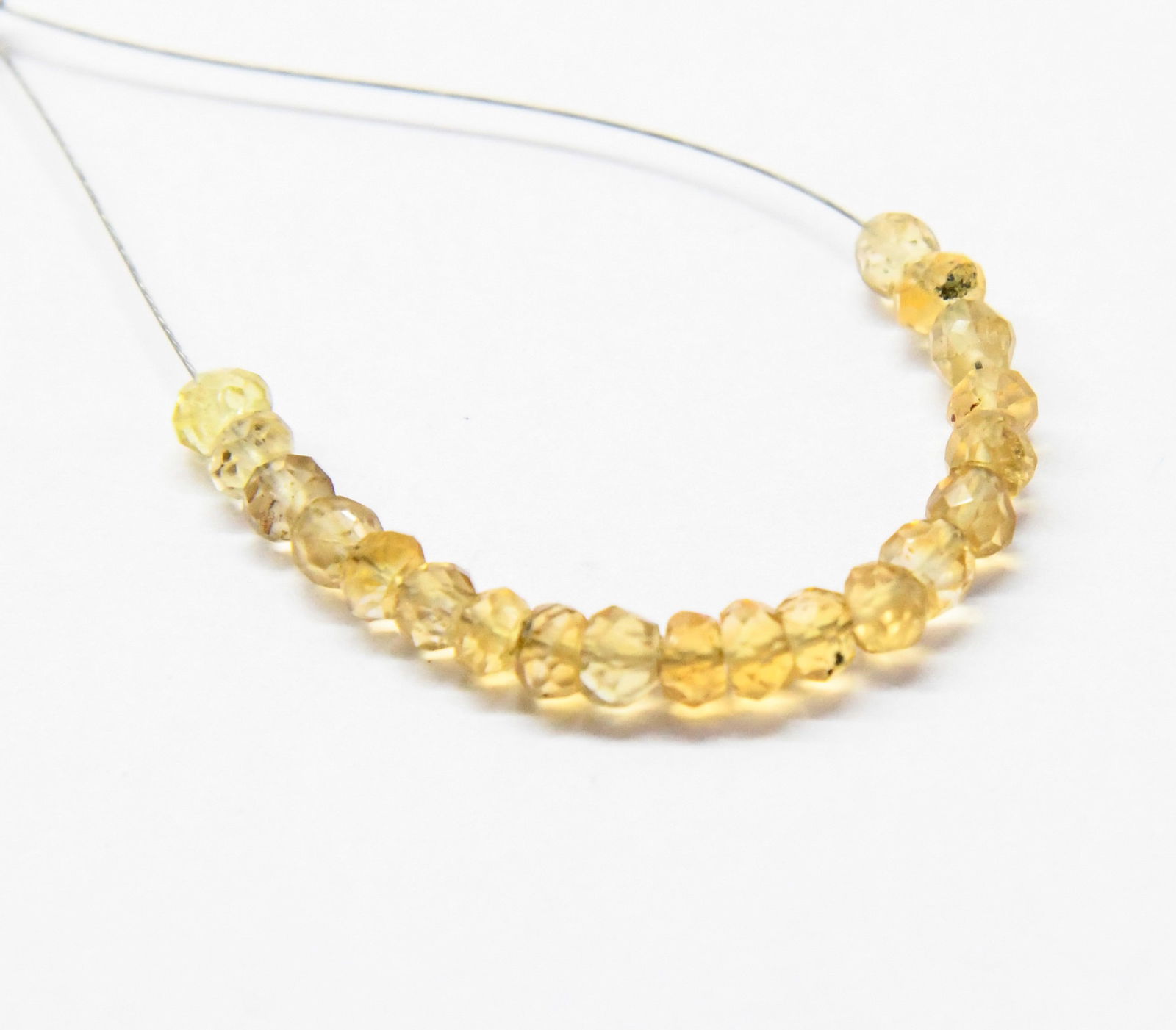 NATURAL CITRINE BEADS FACETED RONDELLE 3.5 - 4 MM, 20 PCS: These are natural, earth mined and hand crafted with precision. Stone: Citrine, Stone Shape: Faceted Rondelle, Stone Size: 3.5 - 4 mm, Width: 1.5 - 2 mm, Weight: approx. 5 carats. The photographs are