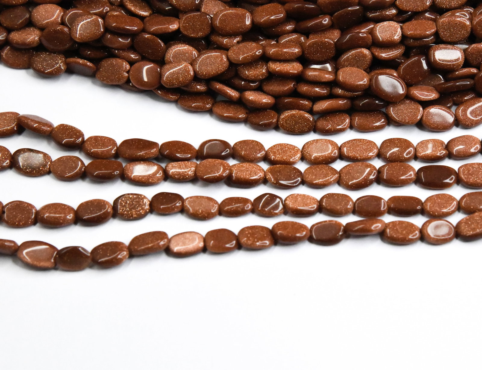 13" STRAND NATURAL GOLDSTONE BEADS OVAL 7X9 - 7X11 MM (2 LINES) (1 of 1)