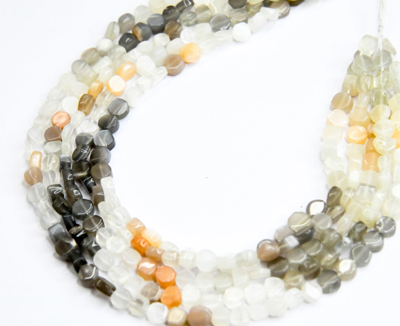 14" STRAND NATURAL MULTI MOONSTONE BEADS COIN 6.5 - 7 MM (2 LINES): These are natural, earth mined and hand crafted with precision. Stone: Multi Moonstone, Stone Shape: Coin, Stone Size: 6.5 - 7 mm, Width: 3 - 4 mm, Length: 14", Weight: approx. 85 carats. The photogra
