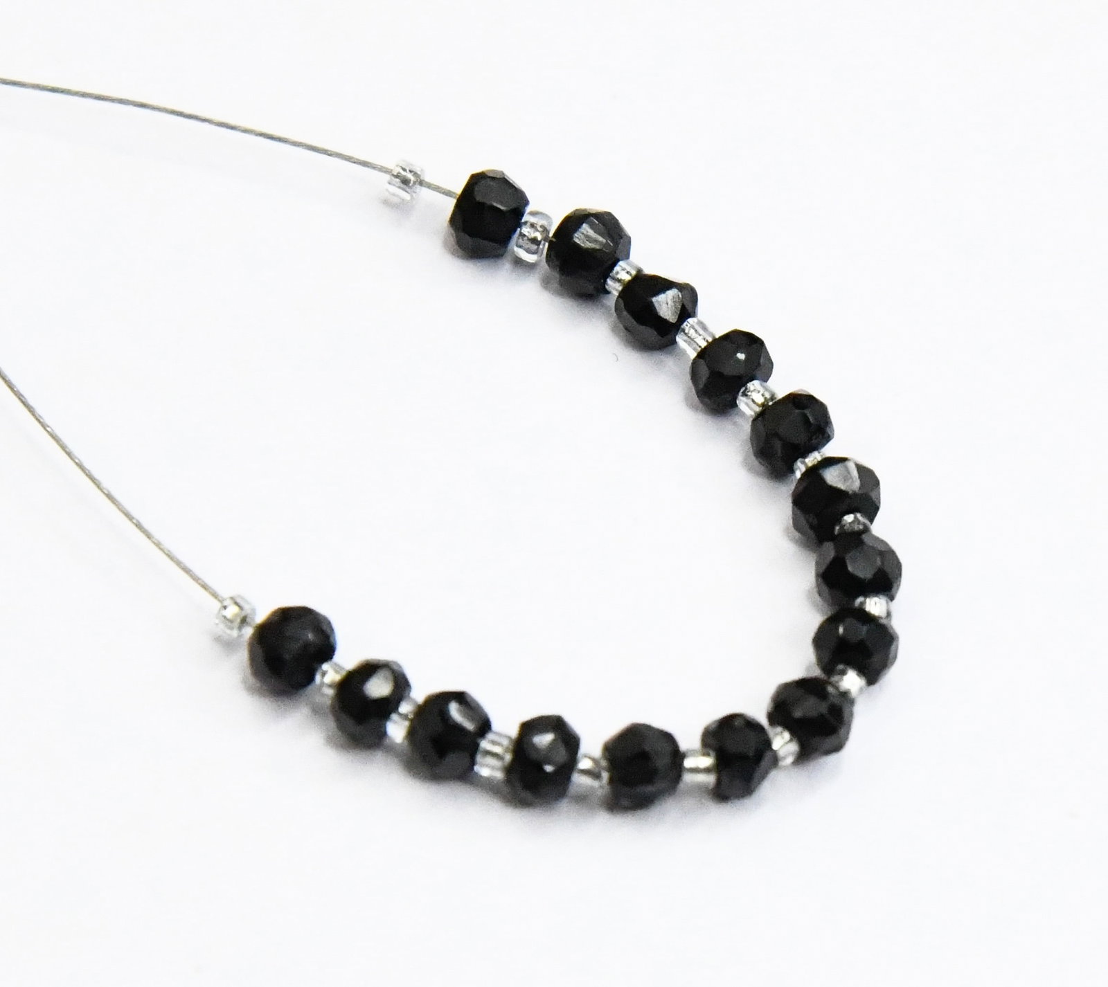 NATURAL BLACK SPINEL BEADS FACETED RONDELLE 3.5 - 4 MM 15 PCS (4 TASSELS): These are natural, earth mined and hand crafted with precision. Stone: Black Spinel, Stone Shape: Faceted Rondelle, Stone Size: 3.5 - 4 mm, Width: 2 - 3 mm, Weight: approx. 6.31 carats. The photograph