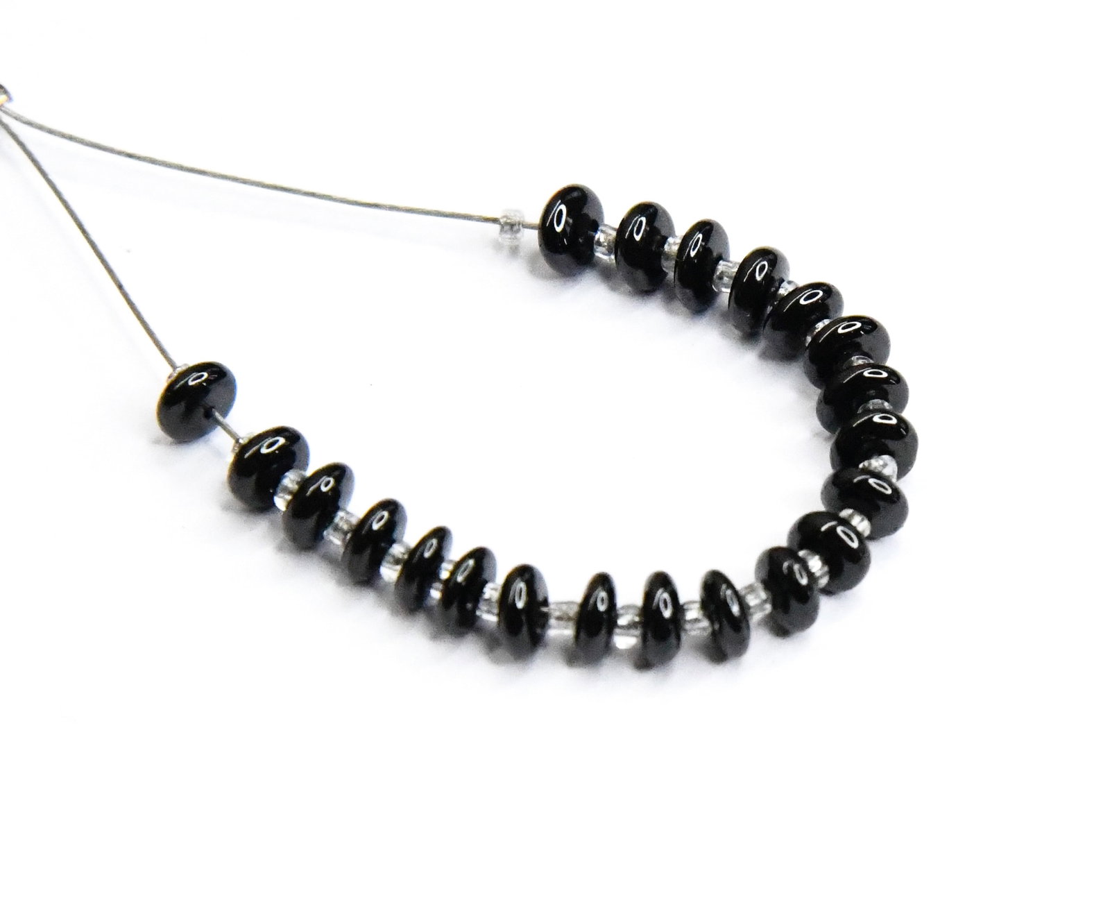 NATURAL BLACK SPINEL BEADS RONDELLE 4 MM 21 PCS (1 TASSELS): These are natural, earth mined and hand crafted with precision. Stone: Black Spinel, Stone Shape: Rondelle, Stone Size: 4 mm, Width: 1 - 2 mm, Weight: approx. 8 carats. The photographs are enlarged to