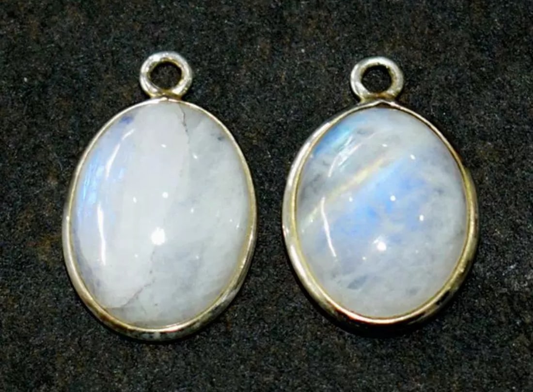 SOLID 925 STERLING SILVER - NATURAL RAINBOW MOONSTONE 12X16 MM 1 PAIR: These are natural, earth mined and hand crafted with precision. Stone: Rainbow Moonstone, Shape: Oval, Size: 12x16 mm, Width - 6 - 7 mm, Weight: approx. 19.50 carats. The photographs are enlarged to s