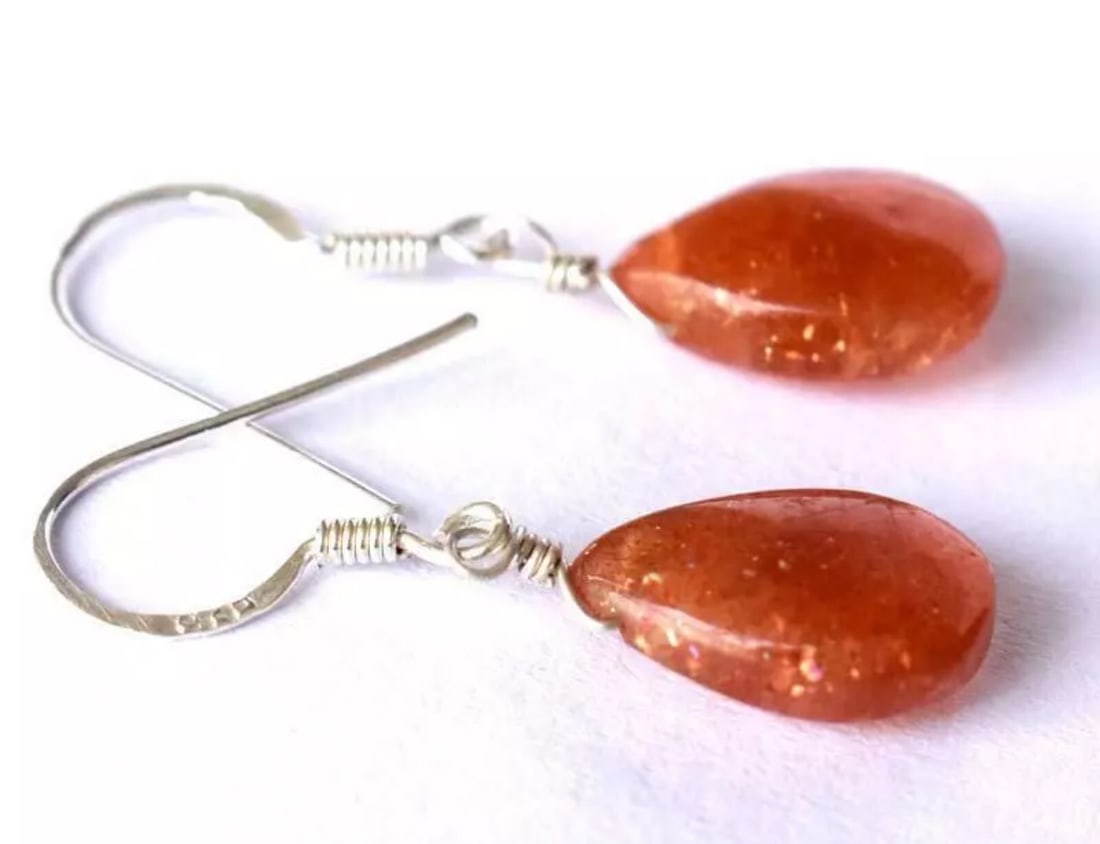 SOLID 925 STERLING SILVER EARRINGS - NATURAL SUNSTONE BEADS: These are natural, earth mined and hand crafted with precision. Stone: Sunstone, Shape: Pear, Size: 8.5x13 mm, Width - 4 - 5 mm, Length: 1 1/8", Weight: approx. 9 carats. The photographs are enlarged