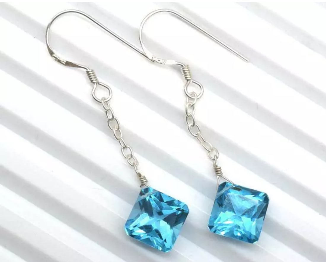 SOLID 925 STERLING SILVER EARRINGS - NATURAL SWISS BLUE TOPAZ: These are natural, earth mined and hand crafted with precision. Stone: Swiss Blue Topaz, Shape: Faceted Square, Size: 11 mm, Width - 6 mm, Length: 1 3/4", Weight: approx. 10.50 carats. The photographs