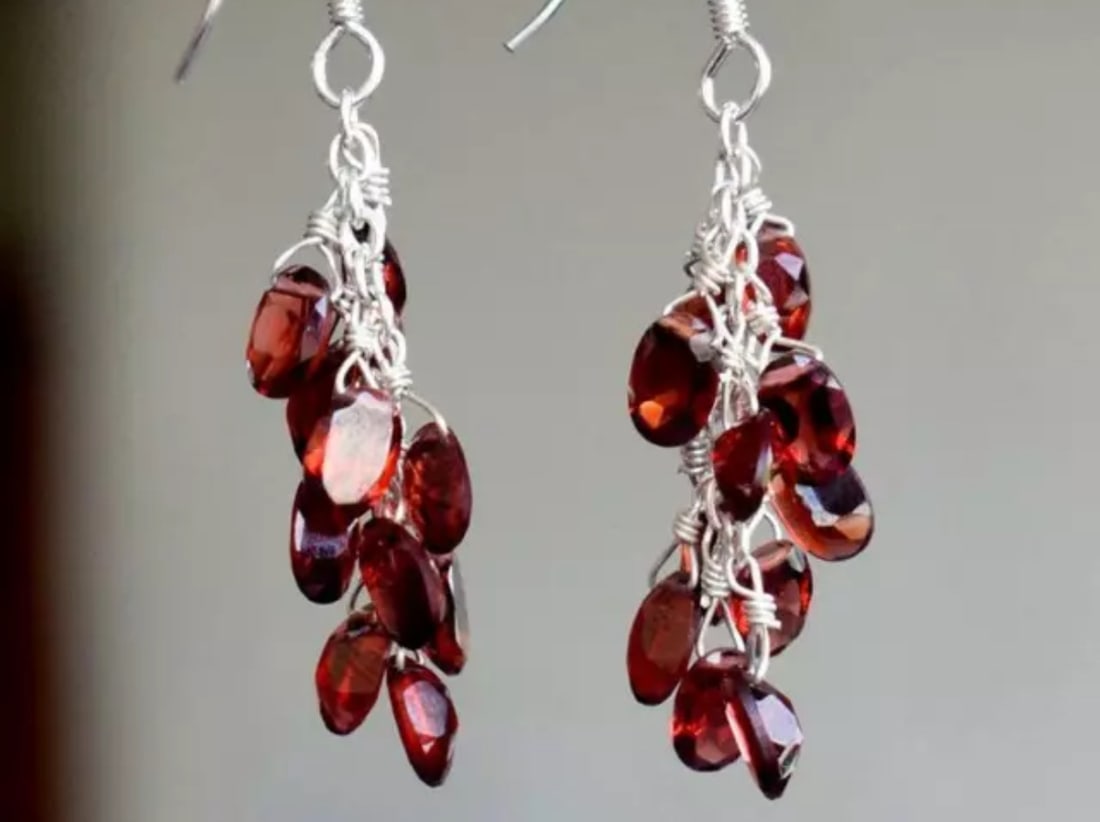 SOLID 925 STERLING SILVER EARRINGS - NATURAL GARNET BEADS: These are natural, earth mined and hand crafted with precision. Stone: Garnet, Shape: Faceted Oval, Size: 4x6 mm, Width - 2 - 2.5 mm, Length: 1 3/4", Weight: approx. 17 carats. The photographs are enl
