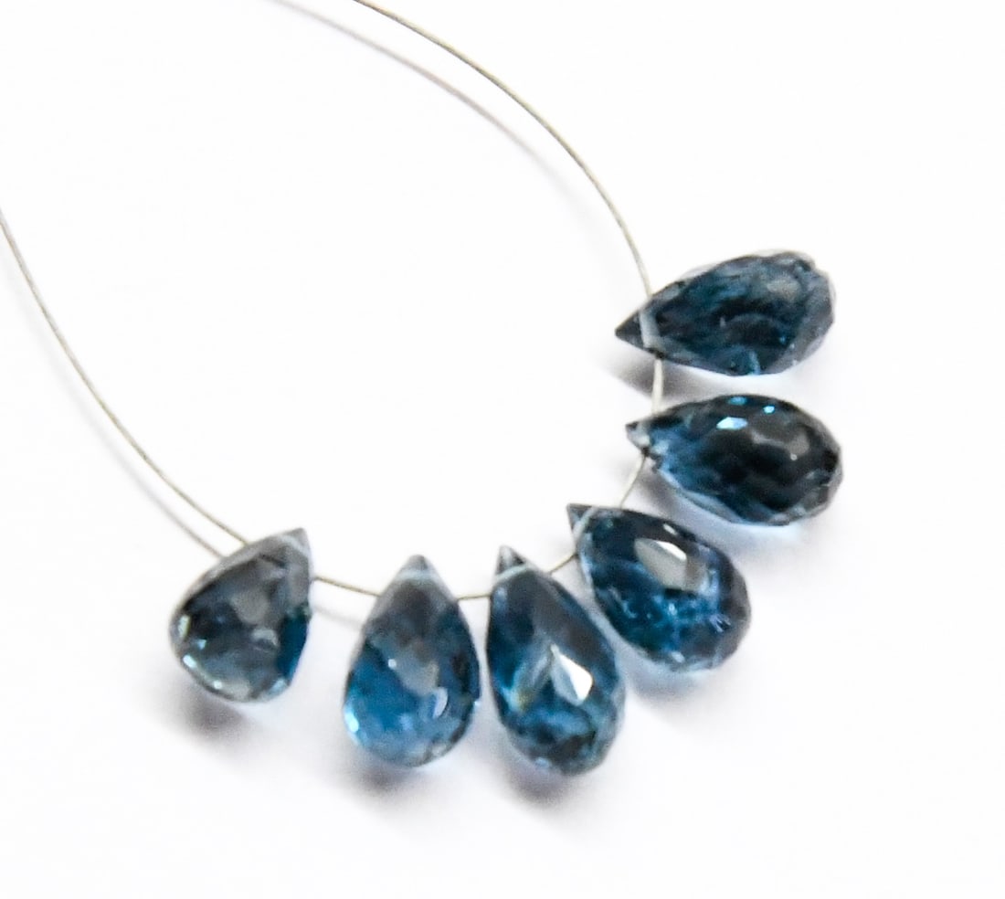 NATURAL LONDON BLUE TOPAZ BEADS FACETED BRIOLETTE 4.5 - 8 MM, 6 PCS: These are natural, earth mined and hand crafted with precision. Stone: London Blue Topaz, Stone Shape: Faceted Briolette, Stone Size: 4.5x8 - 5x8 mm, Weight: approx. 10 carats. The photographs are gen