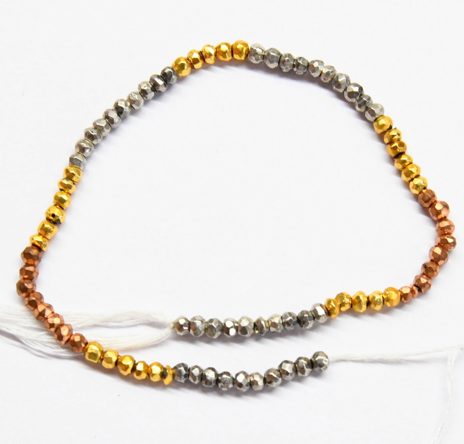 NATURAL PYRITE BEADS (COATED) FACETED RONDELLE 3 - 3.5 MM, 8" STRAND: These are natural, earth mined and hand crafted with precision. Stone: Pyrite, Stone Shape: Faceted Rondelle, Stone Size: 3 - 3.5 mm, Width: 2 - 2.5 mm, Weight: approx. 35 carats. The photographs are