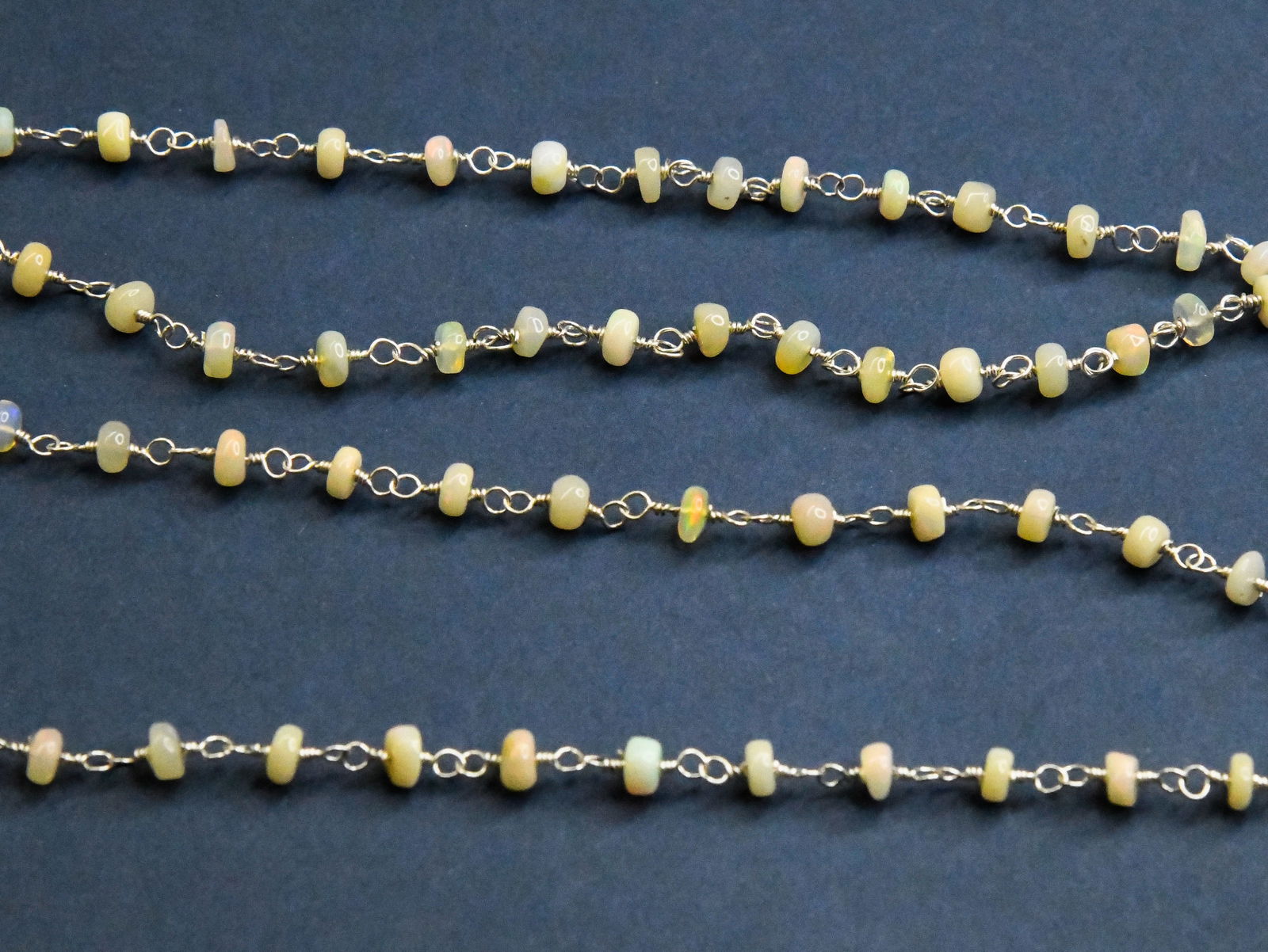 SOLID 925 STERLING SILVER LINK CHAIN - 1 FOOT - NATURAL ETHIOPIAN OPAL: These are natural, earth mined and hand crafted with precision. Stone: Ethiopian Opal, Stone Shape: Rondelle, Stone Size: 4 - 4.5 mm, Width: 2 - 3, Length: 12". The photographs are enlarged to show th