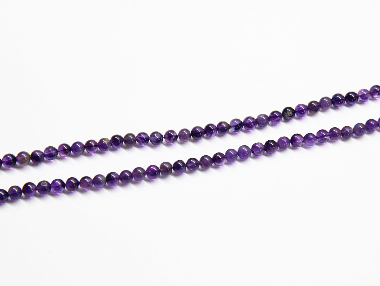 NATURAL AMETHYST BEADS ROUND 4.5 - 5.5 MM, 11" STRAND (2 LINES) (1 of 1)