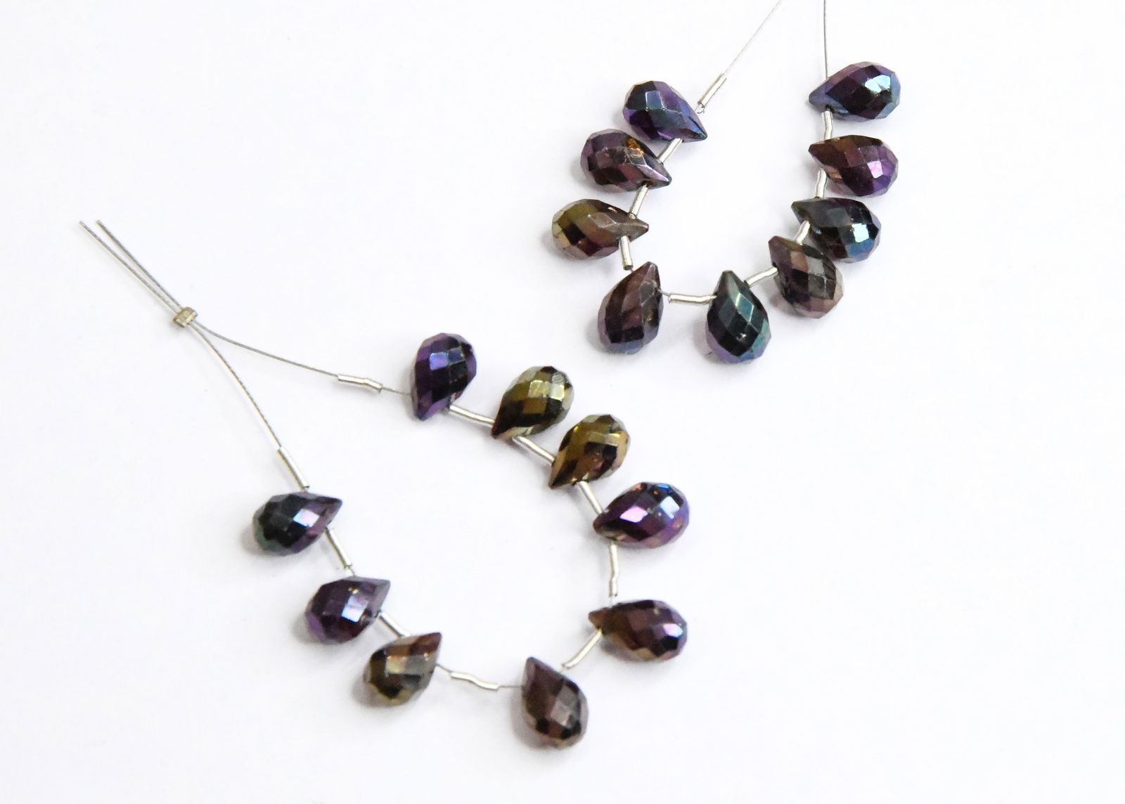 NATURAL PYRITE BEADS (COATED) FACETED BRIOLETTE 6X8 - 5X10 MM, 9 PCS (5 TASSELS): These are natural, earth mined and hand crafted with precision. Stone: Pyrite (Coated), Stone Shape: Faceted Briolette, Stone Size: 6x8.5 - 5.5x10 mm, Weight: approx. 26 cts. The photographs are enlar