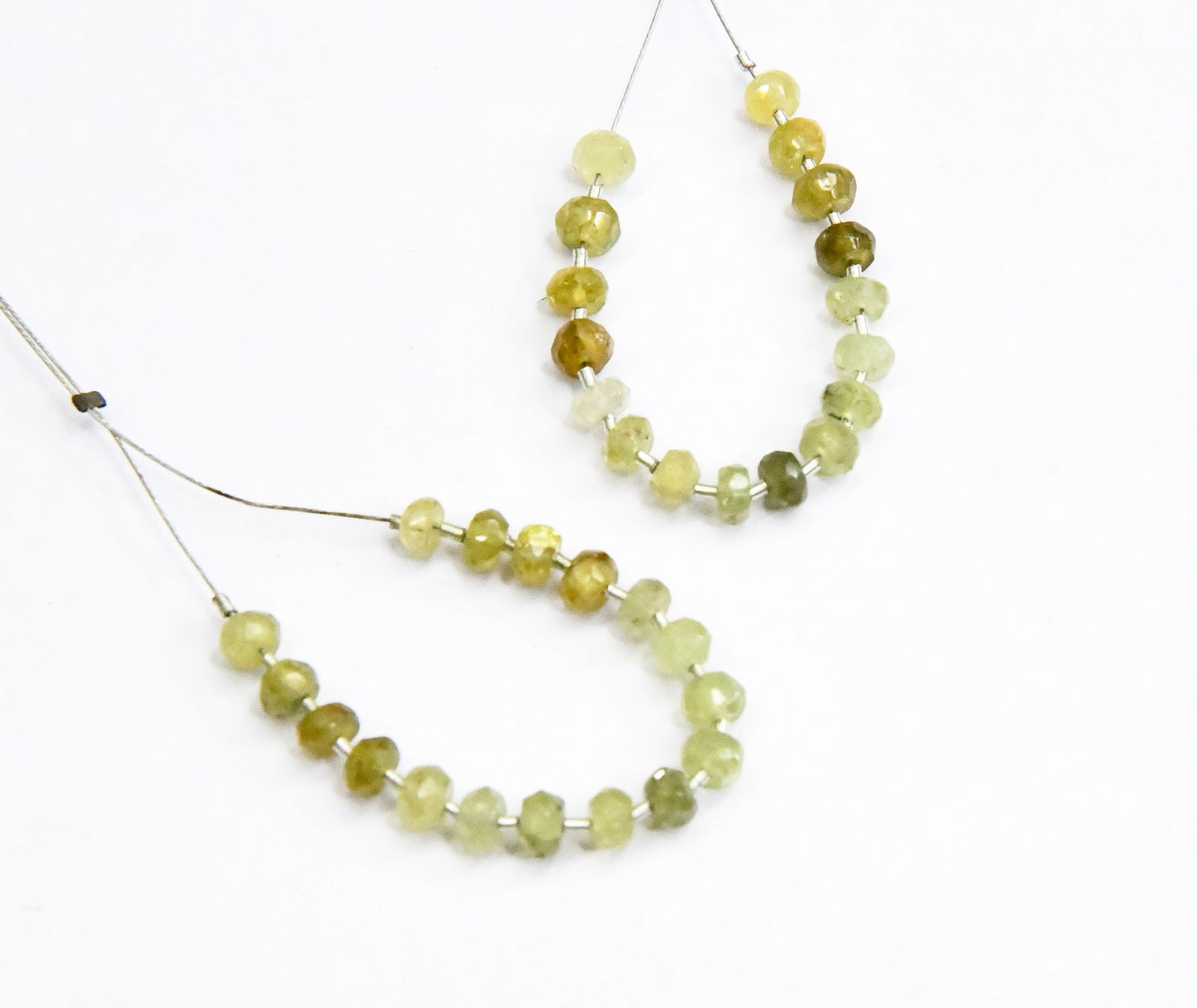 NATURAL GROSSULAR GARNET BEADS FACETED RONDELLE 4 - 4.5 MM, 17 PCS (5 TASSELS): These are natural, earth mined and hand crafted with precision. Stone: Grossular Garnet, Stone Shape: Faceted Rondelle, Stone Size: 4 - 4.5 mm, Width: 2 - 3 mm, Weight: approx. 10 cts. The photographs