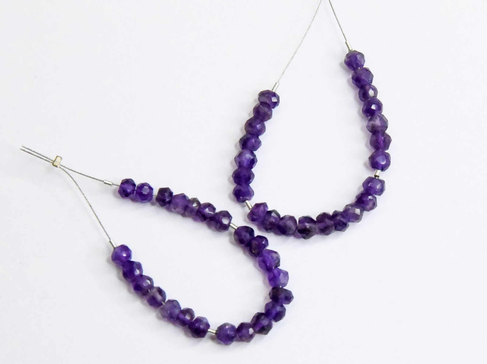 NATURAL AMETHYST BEADS FACETED RONDELLE 4 - 4.5 MM 23 PCS (9 TASSELS): These are natural, earth mined and hand crafted with precision. Stone: Amethyst, Stone Shape: Faceted Rondelle, Stone Size: 4 - 4.5 mm Width: 2.5 - 3.5 mm, Weight: approx. 11.7 carats. The photographs