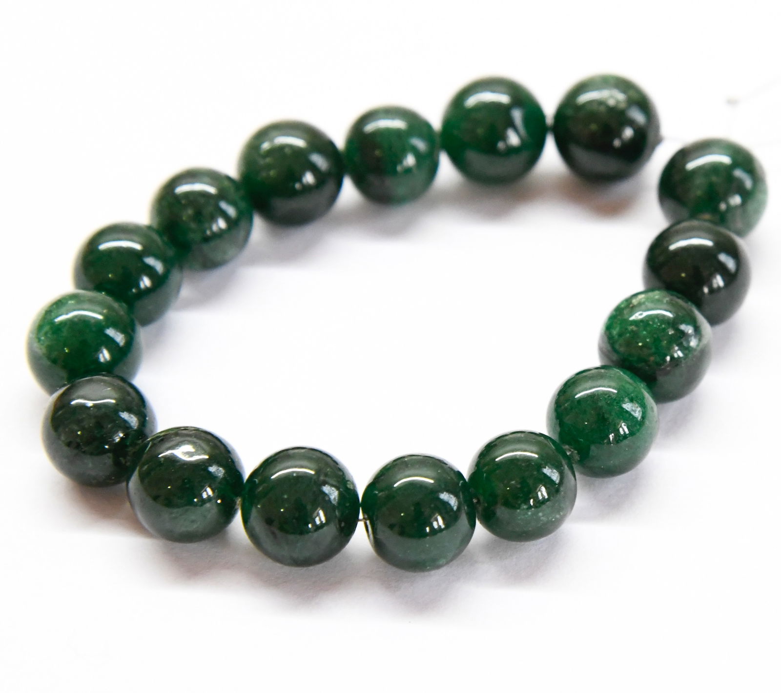 NATURAL GREEN AVENTURINE BEADS ROUND 10 - 10.5 MM, 6" STRAND: These are natural, earth mined and hand crafted with precision. Stone: Green Aventurine, Stone Shape: Round, Stone Size: 10 - 10.5 mm, Weight: approx. 130 carats. The photographs are generally enlarge