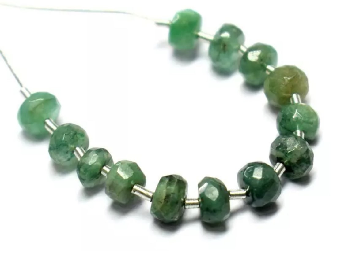 NATURAL EMERALD BEADS FACETED RONDELLE 4.5 MM 13 PCS (3 TASSELS): These are natural, earth mined and hand crafted with precision. Stone: Emerald, Stone Shape: Faceted Rondelle, Stone Size: 4.5mm, Width: 2 - 3mm, Weight: approx. 6.50 carats. The photographs are enlar