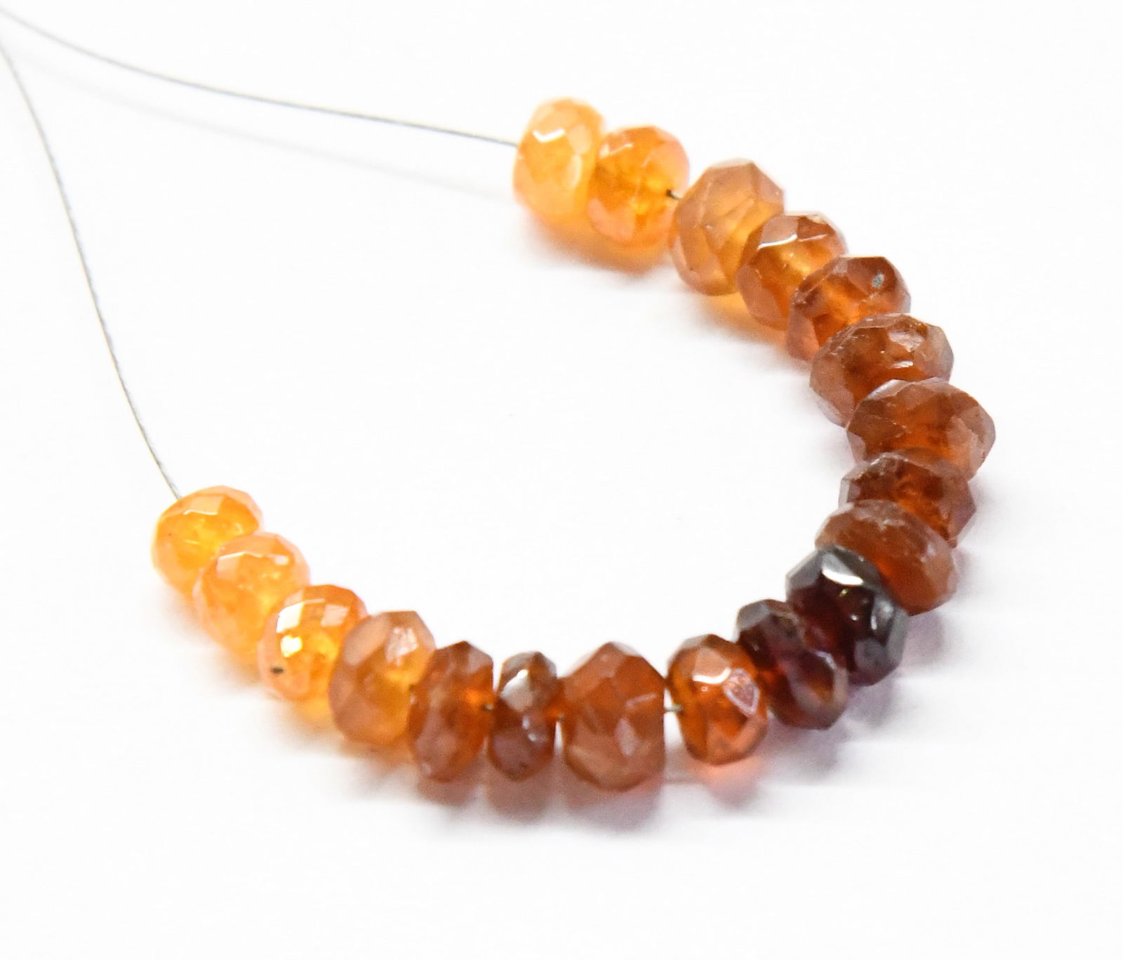 NATURAL HESSONITE GARNET BEADS FACETED RONDELLE 5 - 6.5 MM, 19 PCS: These are natural, earth mined and hand crafted with precision. Stone: HessoniteGarnet, Stone Shape: Faceted Rondelle, Stone Size: 5 - 6.5 mm, Width: 3 - 3.5 mm, Weight: approx. 22 carats. The photogr