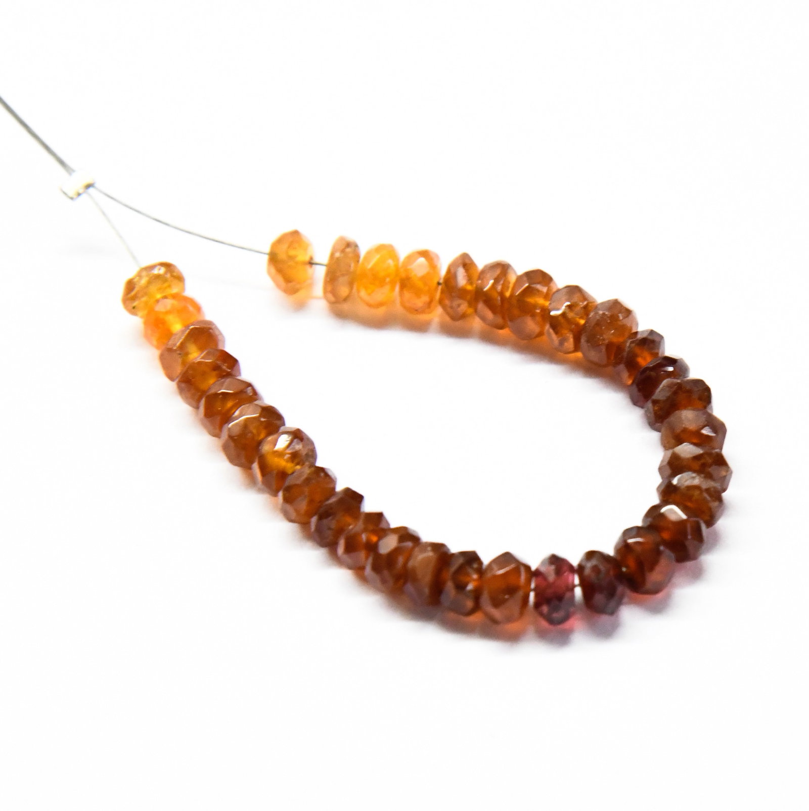 NATURAL HESSONITE GARNET BEADS FACETED RONDELLE 5 MM, 33 PCS: These are natural, earth mined and hand crafted with precision. Stone: Hessonite Garnet, Stone Shape: Faceted Rondelle, Stone Size: 5 mm, Width: 2.5 - 3.5 mm, Weight: approx. 29 carats. The photograph