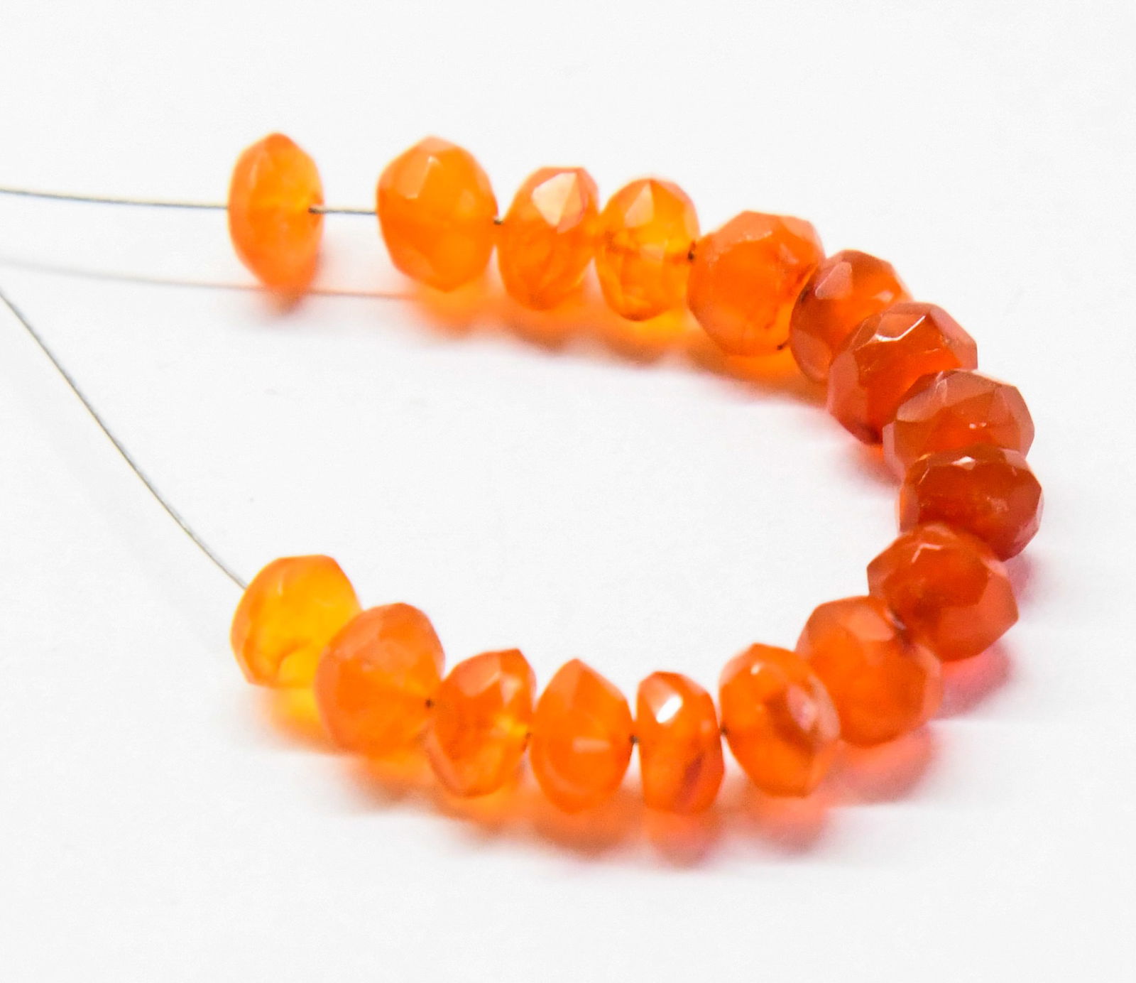 NATURAL CARNELIAN BEADS FACETED RONDELLE 5.5 - 6 MM, 17 PCS (2 TASSELS): These are natural, earth mined and hand crafted with precision. Stone: Carnelian, Stone Shape: Faceted Rondelle, Stone Size: 5.5 - 6 mm, Width: 3 - 5 mm, Weight: approx. 15 carats. The photographs are