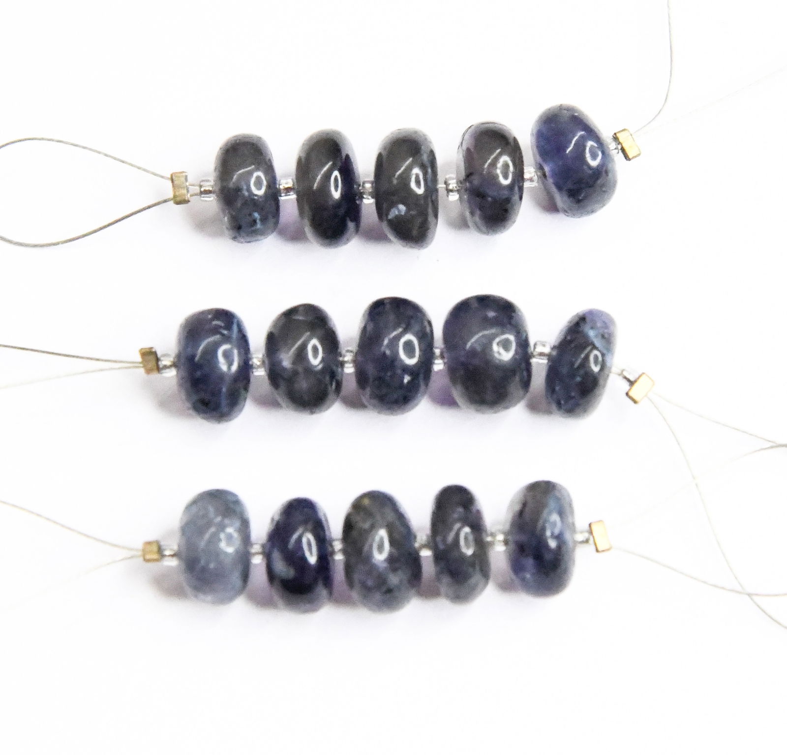 NATURAL IOLITE BEADS RONDELLE 8.5 - 9 MM 5 PCS (3 TASSELS): These are natural, earth mined and hand crafted with precision. Stone: Iolite, Stone Shape: Rondelle, Stone Size: 8.5 - 9 mm, Weight: approx. 16 carats. The photographs are enlarged to show the clarit
