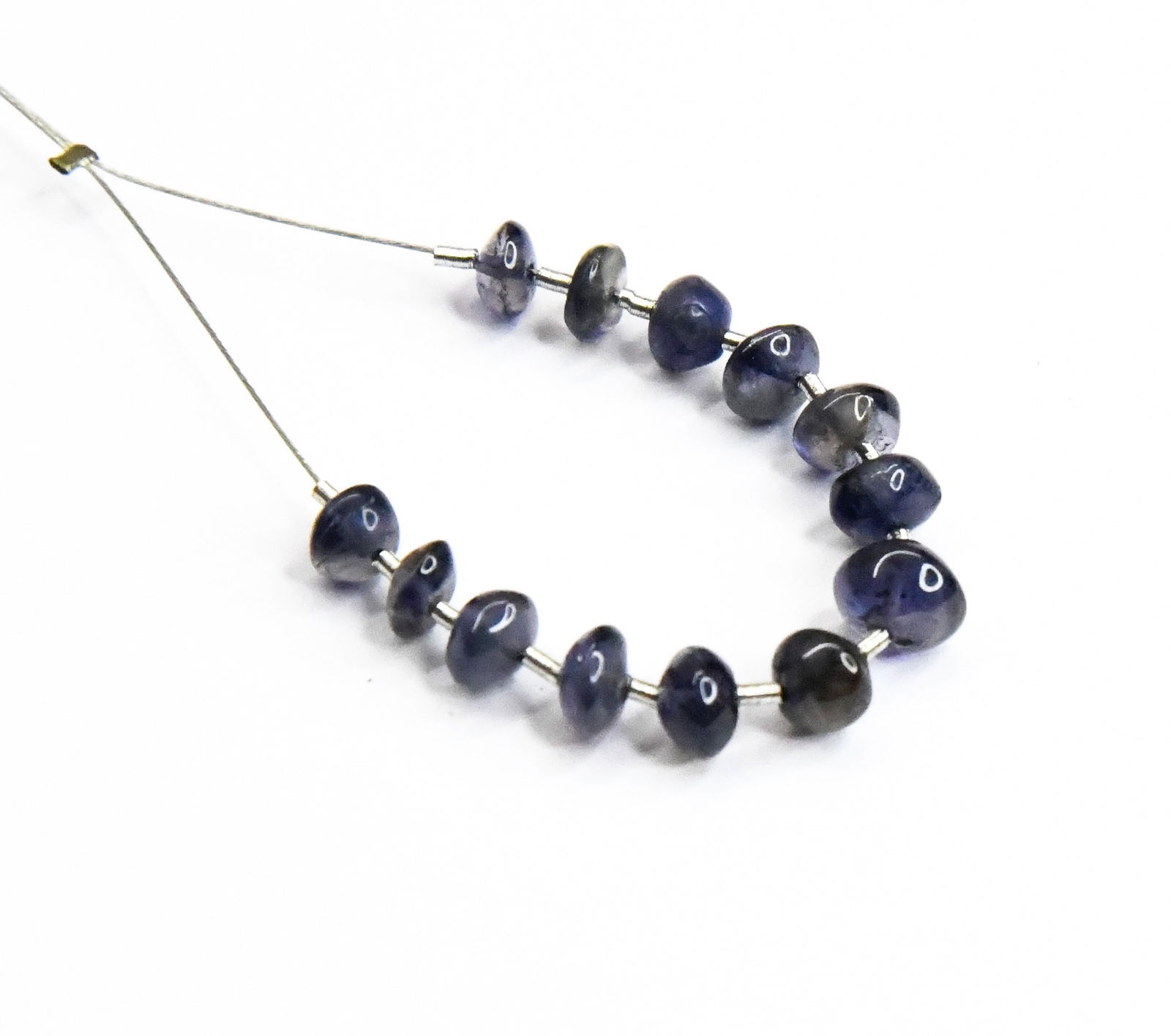 NATURAL IOLITE BEADS RONDELLE 4.5 - 5.5 MM 13 PCS (3 TASSELS): These are natural, earth mined and hand crafted with precision. Stone: Iolite, Stone Shape: Rondelle, Stone Size: 4.5 - 5.5 mm, Width: 2.5 - 3.5 mm, Weight: approx. 7.45 carats. The photographs are en