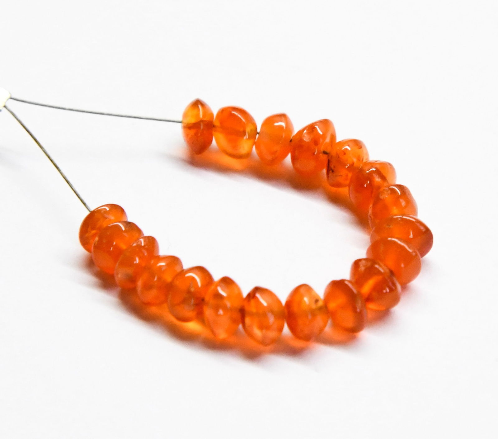 NATURAL CARNELIAN BEADS RONDELLE 5 - 5.5 MM, 19 PCS: These are natural, earth mined and hand crafted with precision. Stone: Carnelian, Stone Shape: Rondelle, Stone Size: 5 - 5.5 mm, Width: 3 - 4 mm, Weight: approx. 13 carats. The photographs are general