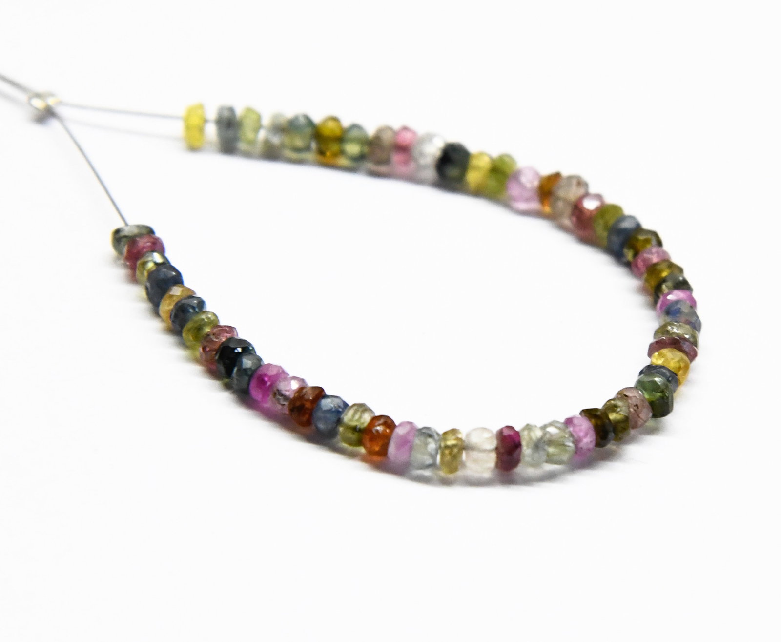 NATURAL MULTI TOURMALINE BEADS FACETED RONDELLE 3 MM, 57 PCS: These are natural, earth mined and hand crafted with precision. Stone: Multi Sapphire, Stone Shape: Faceted Rondelle, Stone Size: 3 mm, Width: 1.5 - 2 mm, Weight: approx. 10 carats. The photographs ar