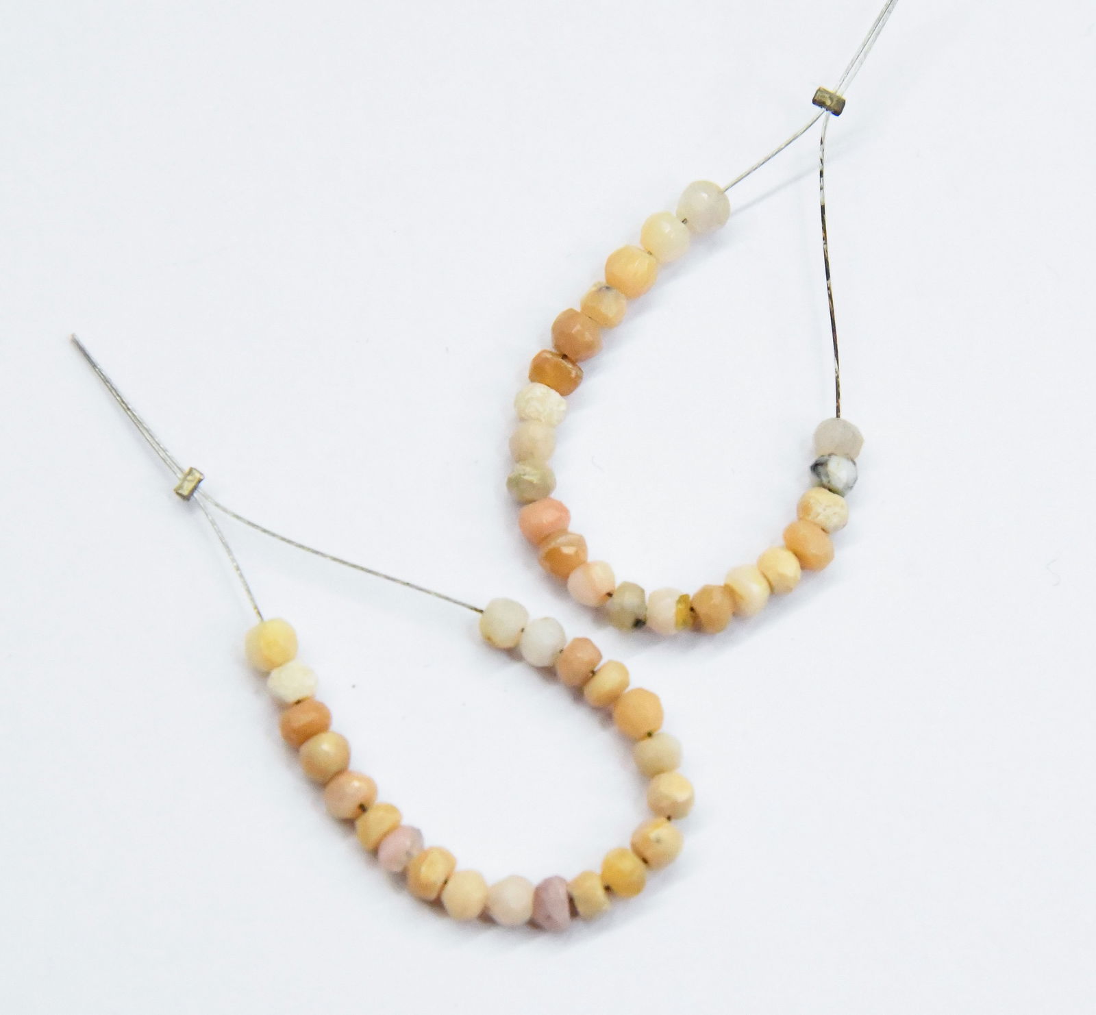 NATURAL PINK OPAL BEADS FACETED RONDELLE 3.5 - 5 MM 21 PCS (5 TASSELS): These are natural, earth mined and hand crafted with precision. Stone: Pink Opal, Stone Shape: Faceted Rondelle, Stone Size: 3.5 - 5 mm, Width: 2 - 3 mm, Weight: approx. 5 carats. The photographs are