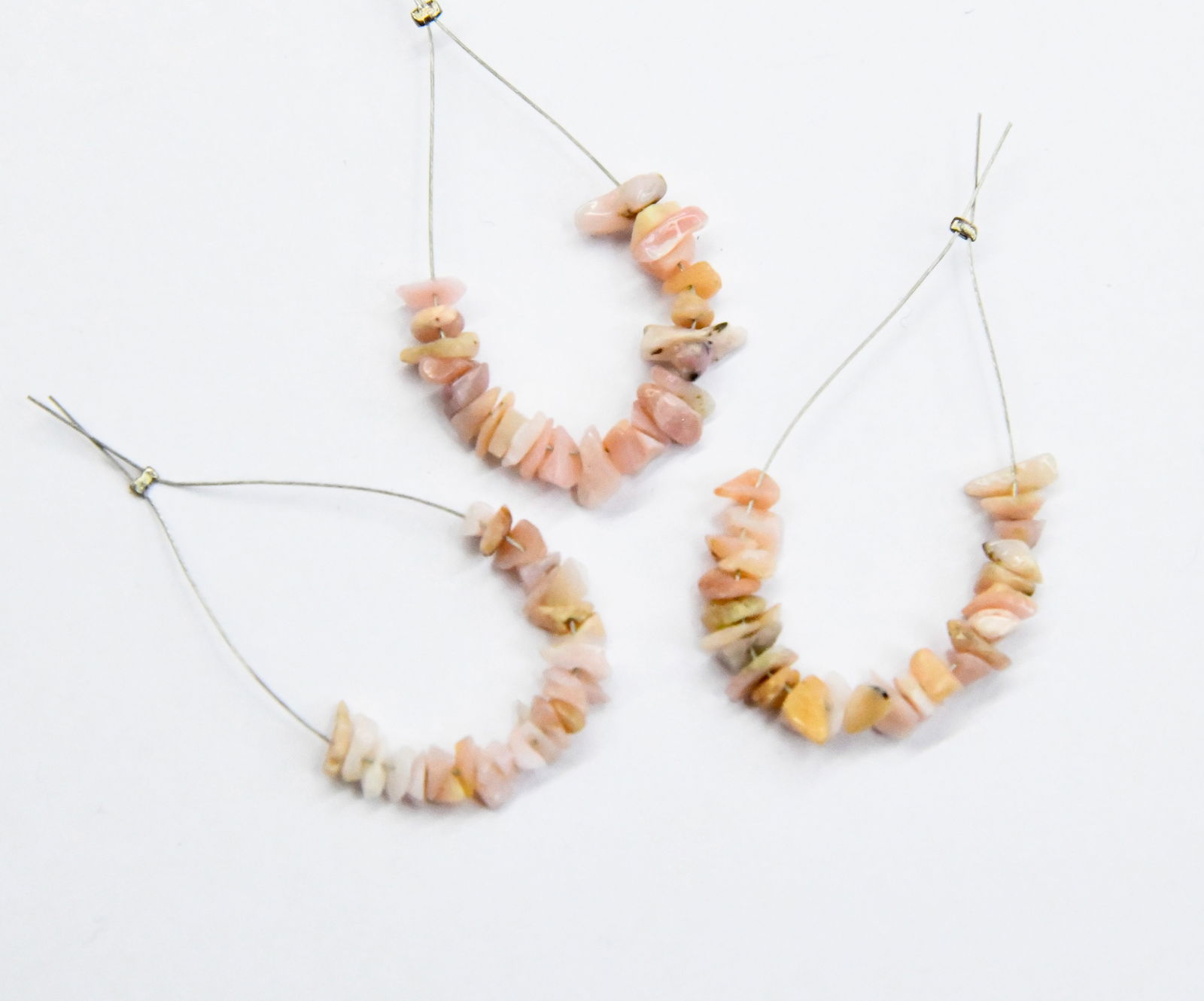 NATURAL PINK OPAL BEADS CHIPS 2X3 - 4X7 MM 25 PCS (5 TASSELS): These are natural, earth mined and hand crafted with precision. Stone: Pink Opal, Stone Shape: Chips, Stone Size: 2.5x3.5 mm, Width: 1.5 - 3 mm, Weight: approx. 4.86 carats. The photographs are enlarg