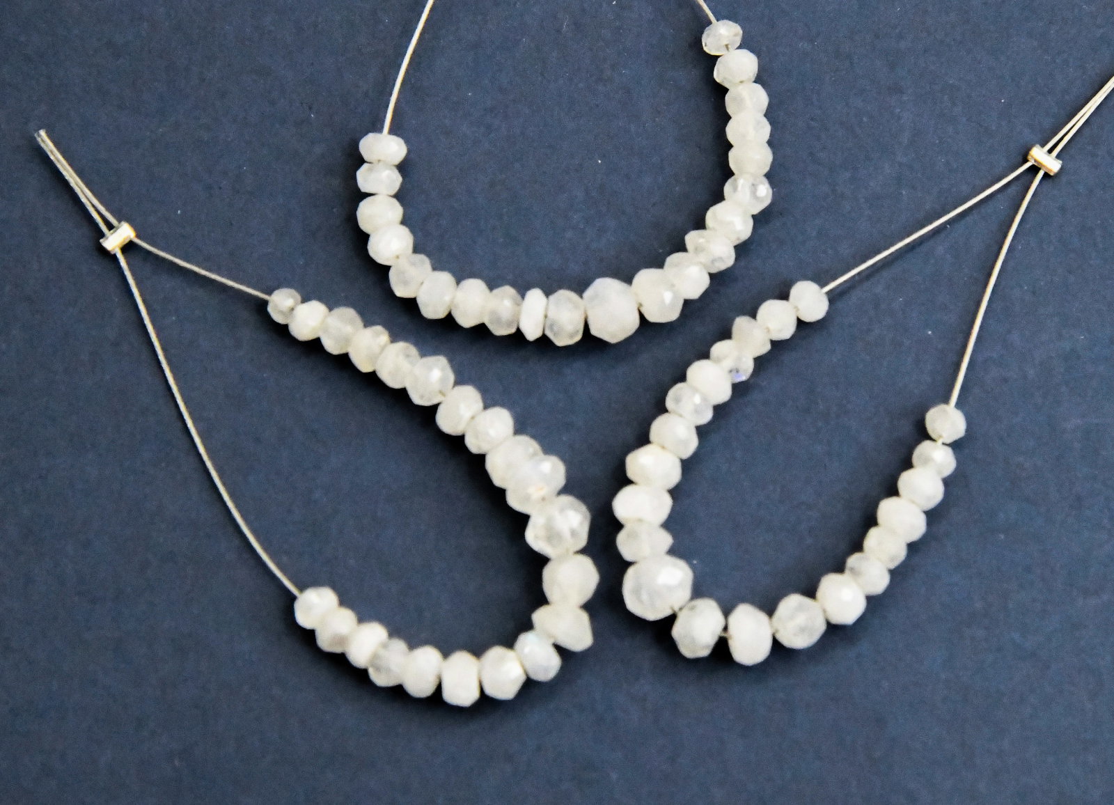 NATURAL RAINBOW MOONSTONE BEADS FACETED RONDELLE 2.5 - 3.5 MM 21 PCS (5 TASSELS): These are natural, earth mined and hand crafted with precision. Stone: Rainbow Moonstone, Stone Shape: Faceted Rondelle, Stone Size: 2.5 - 3.5 mm, Width: 2.5 - 3 mm, Weight: approx. 4.86 carats. The p