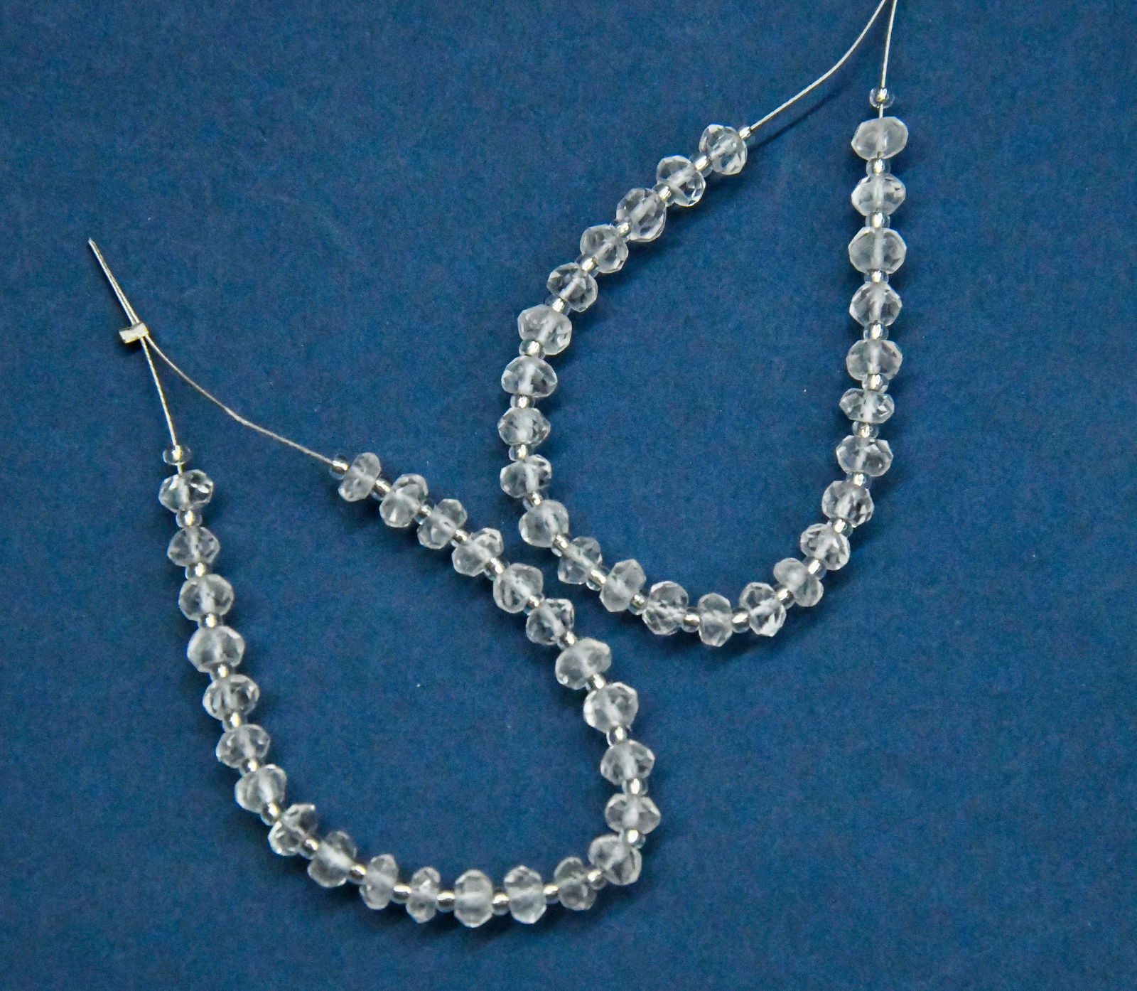NATURAL CRYSTAL BEADS FACETED RONDELLE 4.5 MM, 25 PCS (2 TASSELS): These are natural, earth mined and hand crafted with precision. Stone: Crystal, Stone Shape: Faceted Rondelle, Stone Size: 4.5 mm, Width: 2 - 2.5 mm, Weight: approx. 10.75 carats. The photographs are