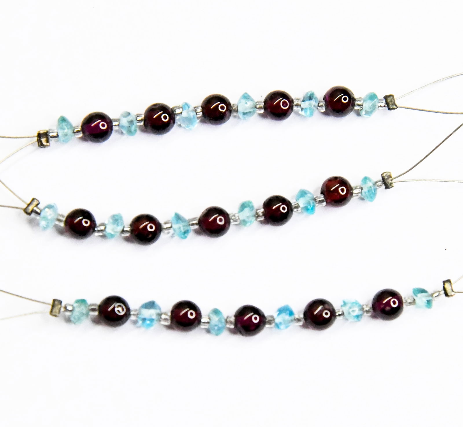 NATURAL APATITE & GARNET BEADS ROUND/RONDELLE 3.5 - 4.5 MM 11 PCS (5 TASSELS): These are natural, earth mined and hand crafted with precision. Stone: Apatite/Garnet, Stone Shape: Rondelle/Round, Stone Size: 3.5 - 4.5mm, Width: 2 - 2.5 mm, Weight: approx. 6 carats. The photograph